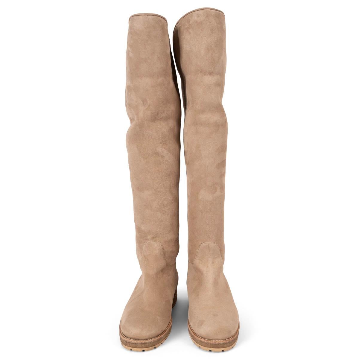 100% authentic Loro Piana shearling lined over-knee boots in beige suede with rubber sole. Have been worn and are in excellent condition. 

Measurements
Imprinted Size	41
Shoe Size	41
Inside Sole	28cm (10.9in)
Width	8cm (3.1in)
Heel	3cm