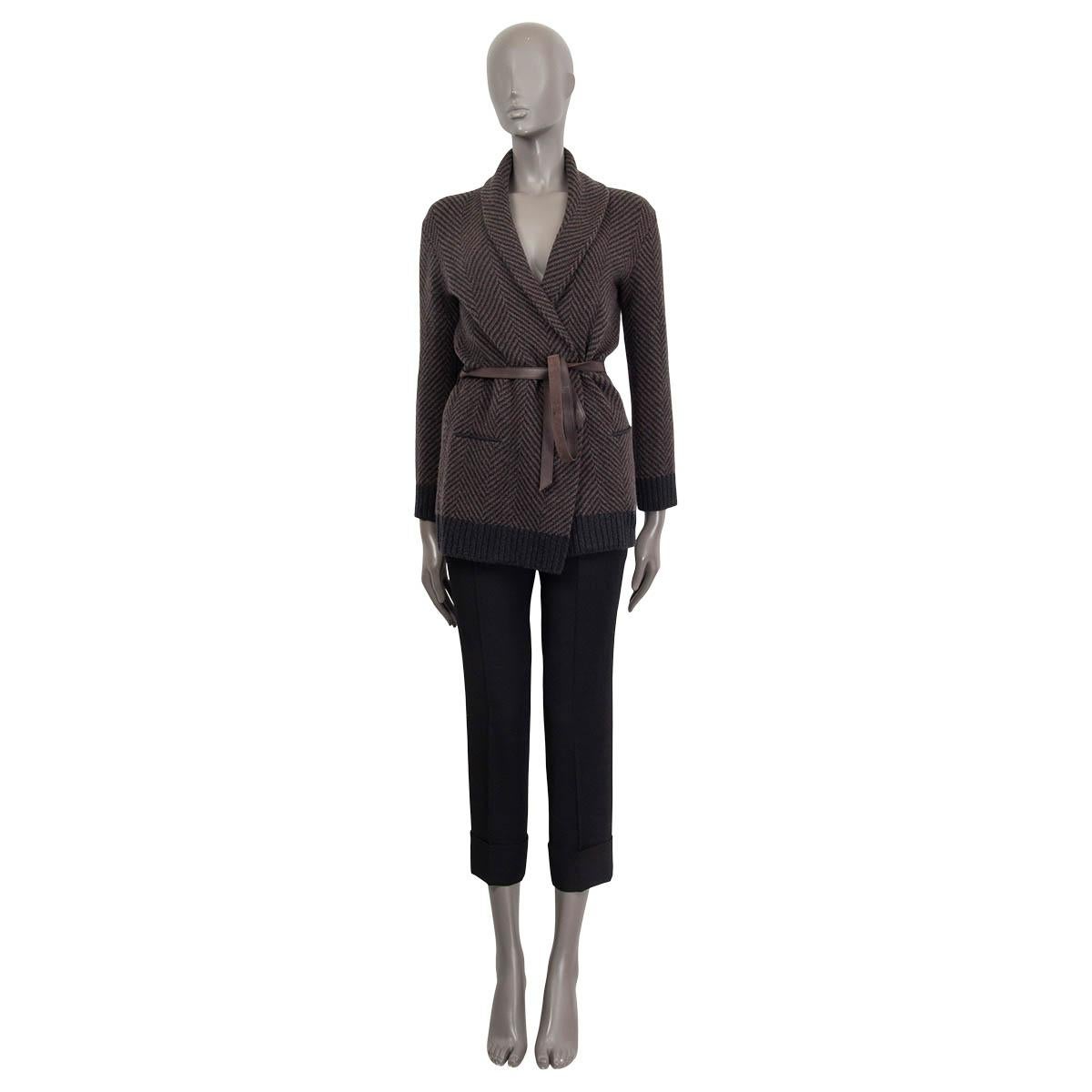 100% authentic Loro Piana open knit cashmere in black and brown baby cashmere (100%). Features a shawl collar, two sewn shut slit pockets on the front and a detachable belt in brown lambskin (100%). Unlined. Has been worn once and is in excellent