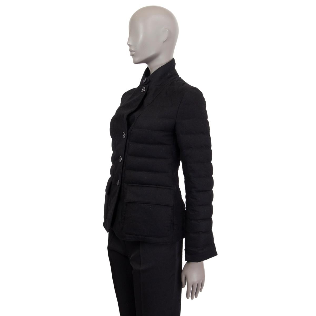 Loro Piana quilted blazer-jacket in black cashmere (100%) with down padding and front flap pockets. Closes on the front with buttons. Lined in polyester (100%). Has been worn and is in excellent condition.

Tag Size 38
Size XS
Shoulder Width 39cm