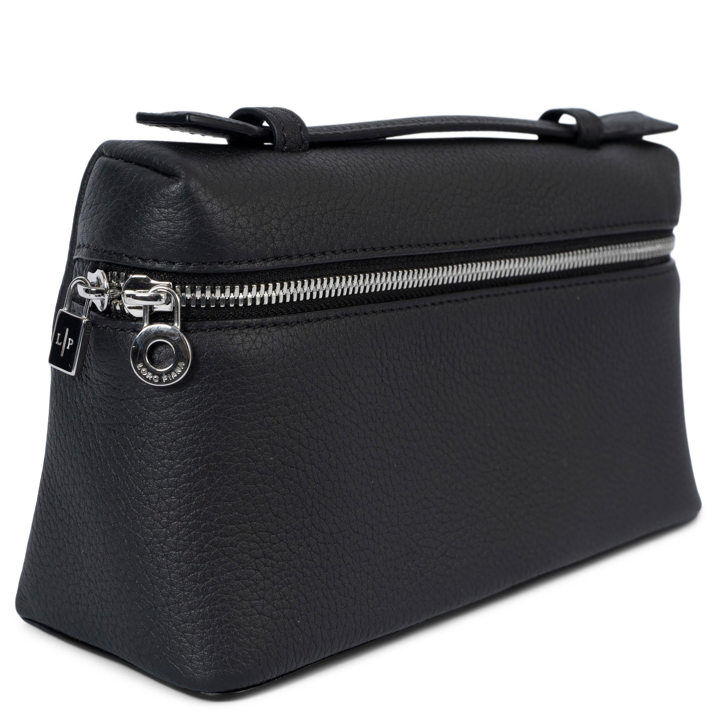 100% authentic Loro Piana Extra Pocket L19 in black grained calfskin featuring silver-tone hardware. Opens with a zipper on top and is lined in smooth black leather. The design comes with a detachable shoulder strap. Has been carried once and is in
