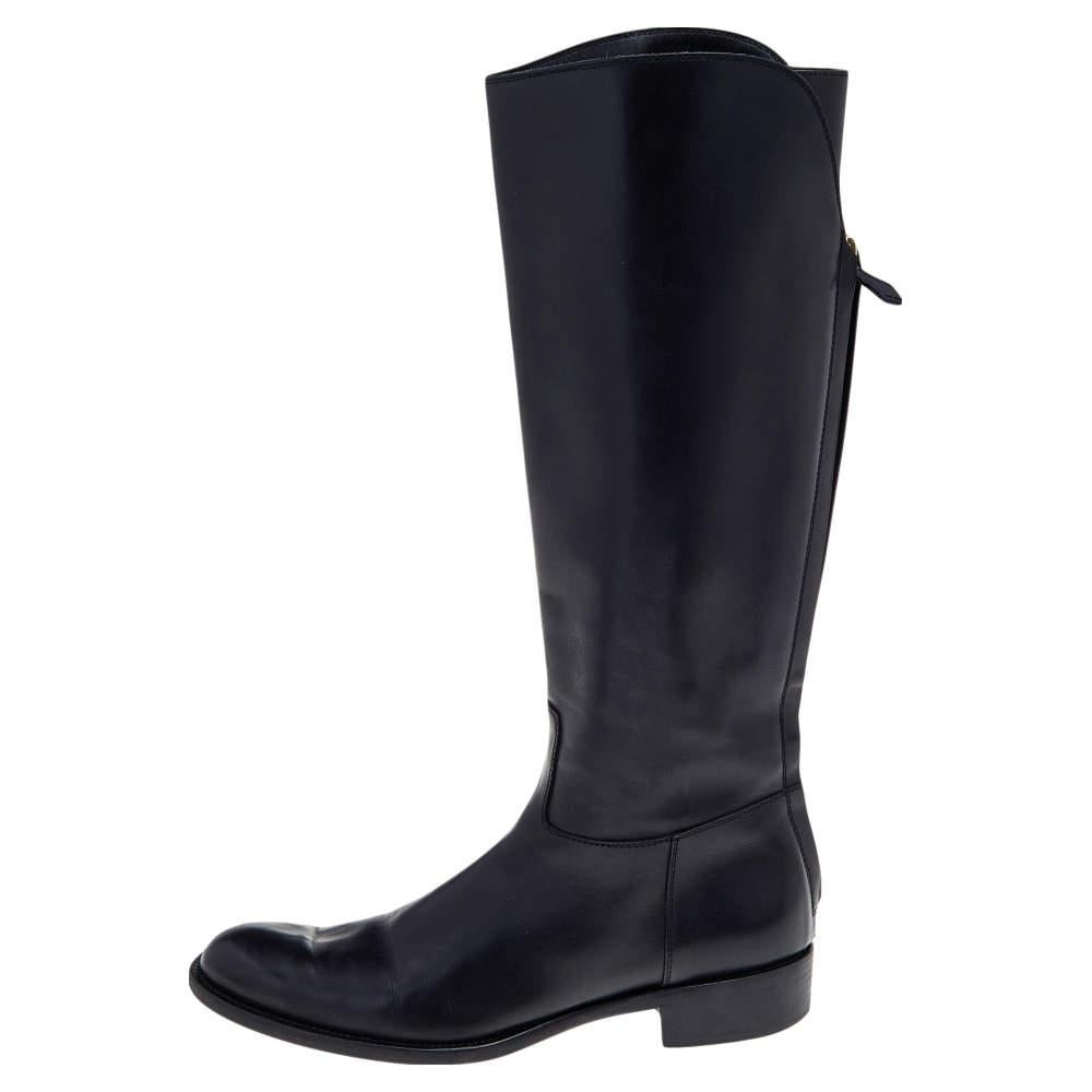 If you're looking to add a pair of knee leather boots to your collection, it should be this from Loro Piana. The black boots are crafted from leather into a chic silhouette. They bring covered toes, leather-lined insoles, and zip fastenings at the