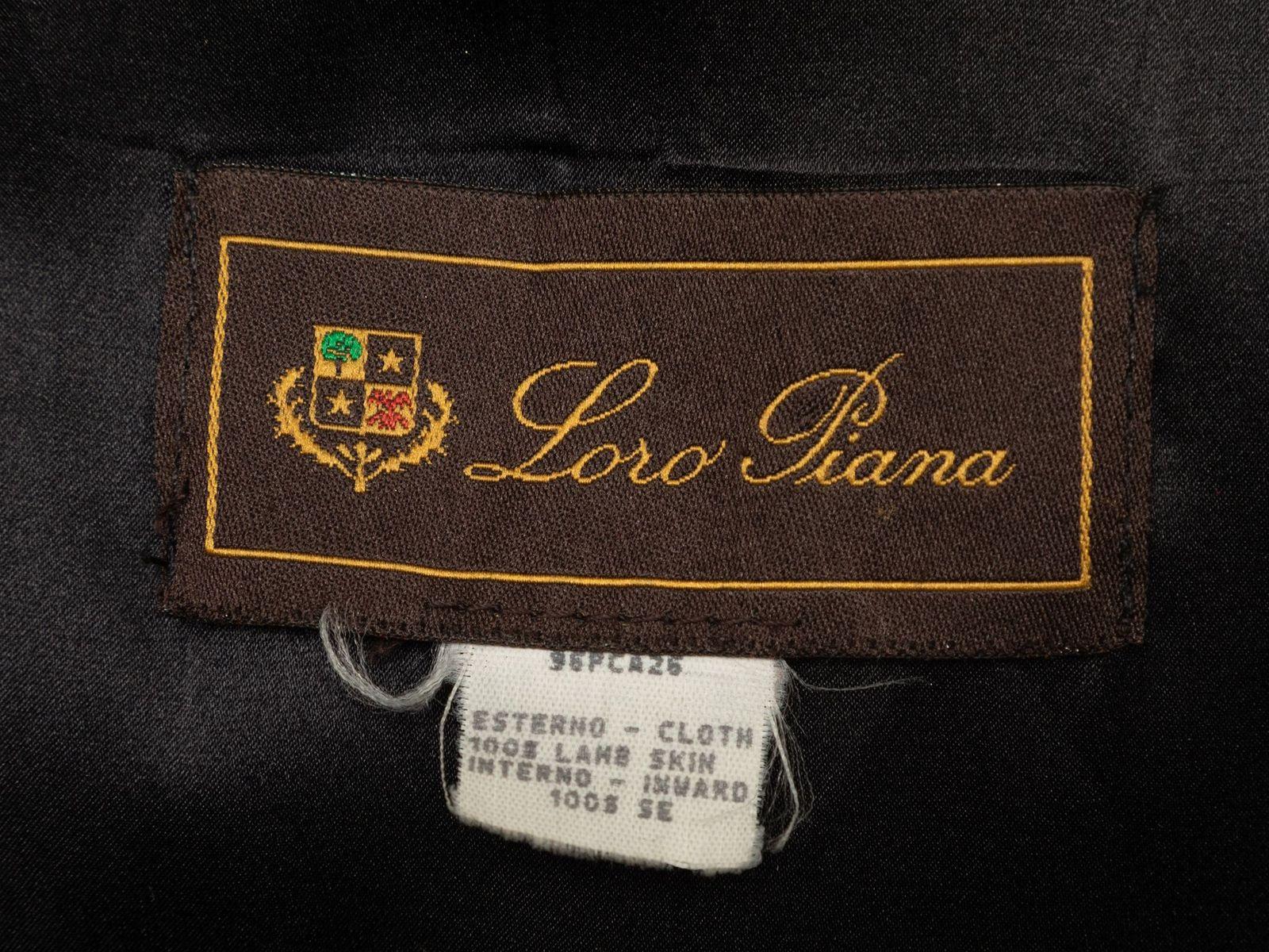 Product Details: Black leather zip-up jacket by Loro Piana. Mandarin collar. Dual flap pockets at hips. Zip closure at center front. Designer size 42. 42