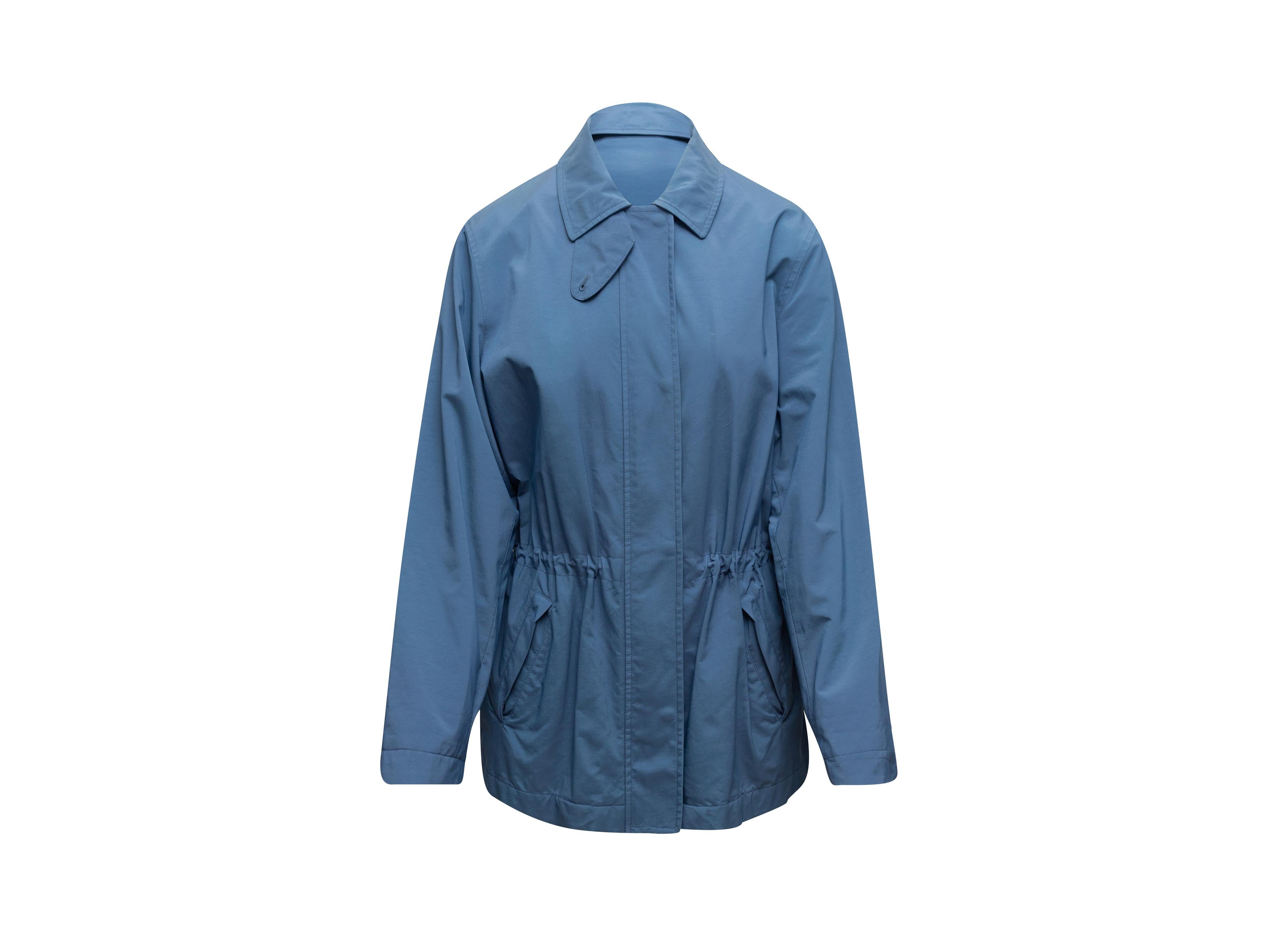 Product details: Blue cotton jacket by Loro Piana. Pointed collar. Cinched waist. Dual hip pockets. Concealed closures at front. Designer size 44. 42