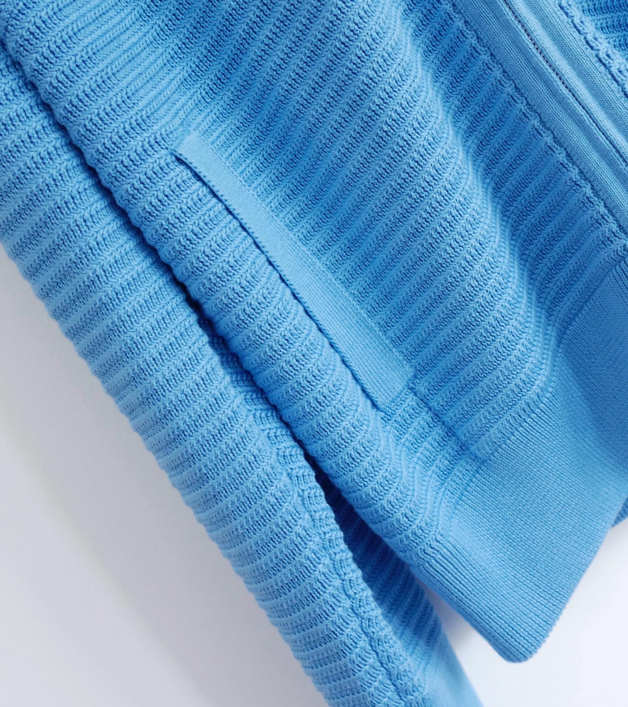 Stunning Loro Piana ribbed silk and cotton cardigan jacket. Bought for £1750 and unworn. Made from bright blue silk and cotton with a textured vertical ribbed knit, it has vertical welt pockets, roomy hood and zip front with LP embossed fobs. The