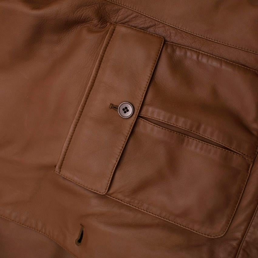Loro Piana Brown Button-Down Leather Jacket

- Button Down Front Closure 
- Front Side Button Pockets 
- Pointed Collar 
- Straight Hemline 
- Long Sleeves
- button Detail at Cuffs
- tonal Stitihcing 
- Internal Pockets 
- Front Chest