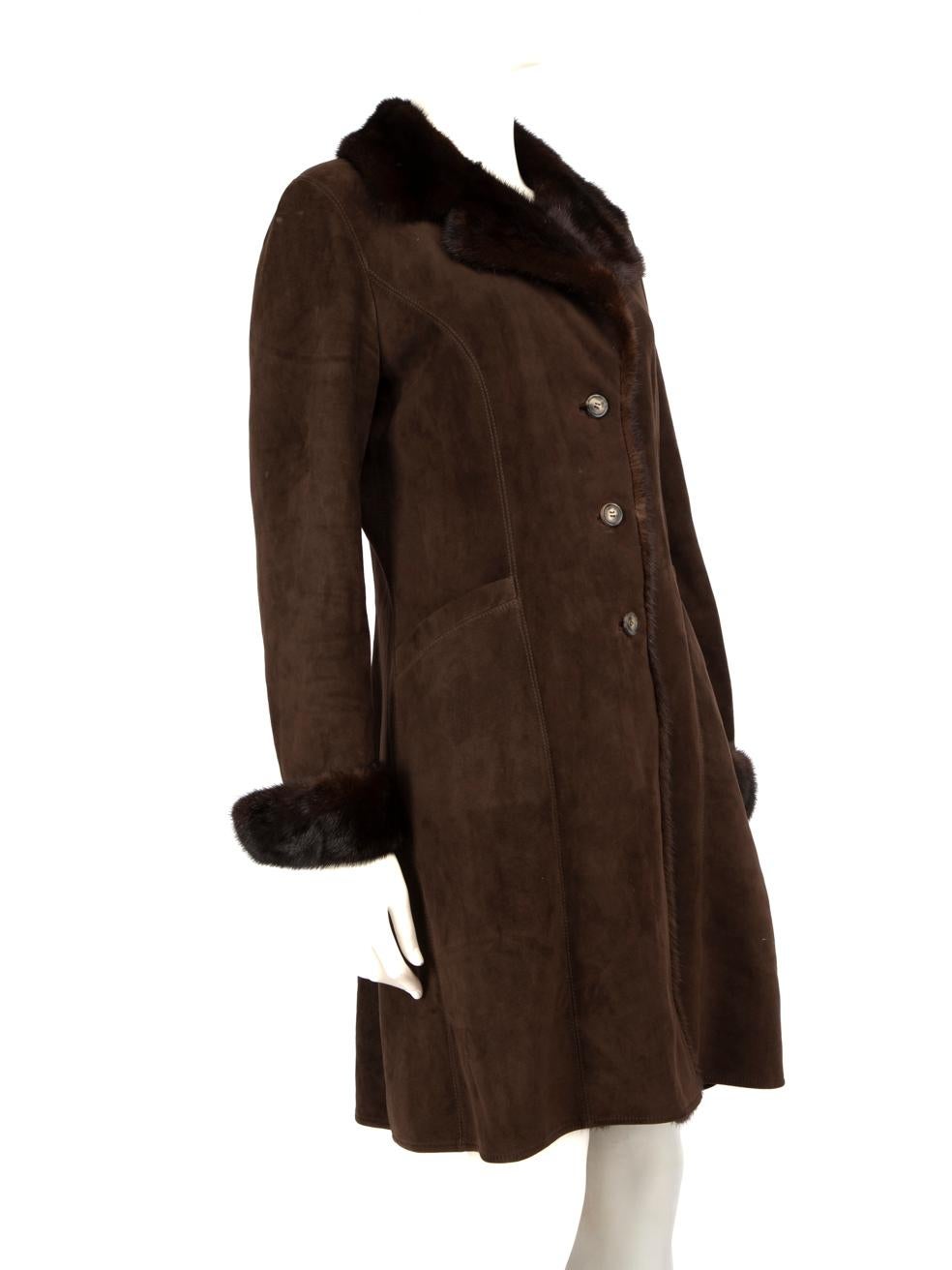 CONDITION is Very good. Minimal wear to the coat is evident, there is mild discolouration on the lining around the underarms, the piping on the hem and the right shoulder. There are small marks on the button placket, the back of the coat and the