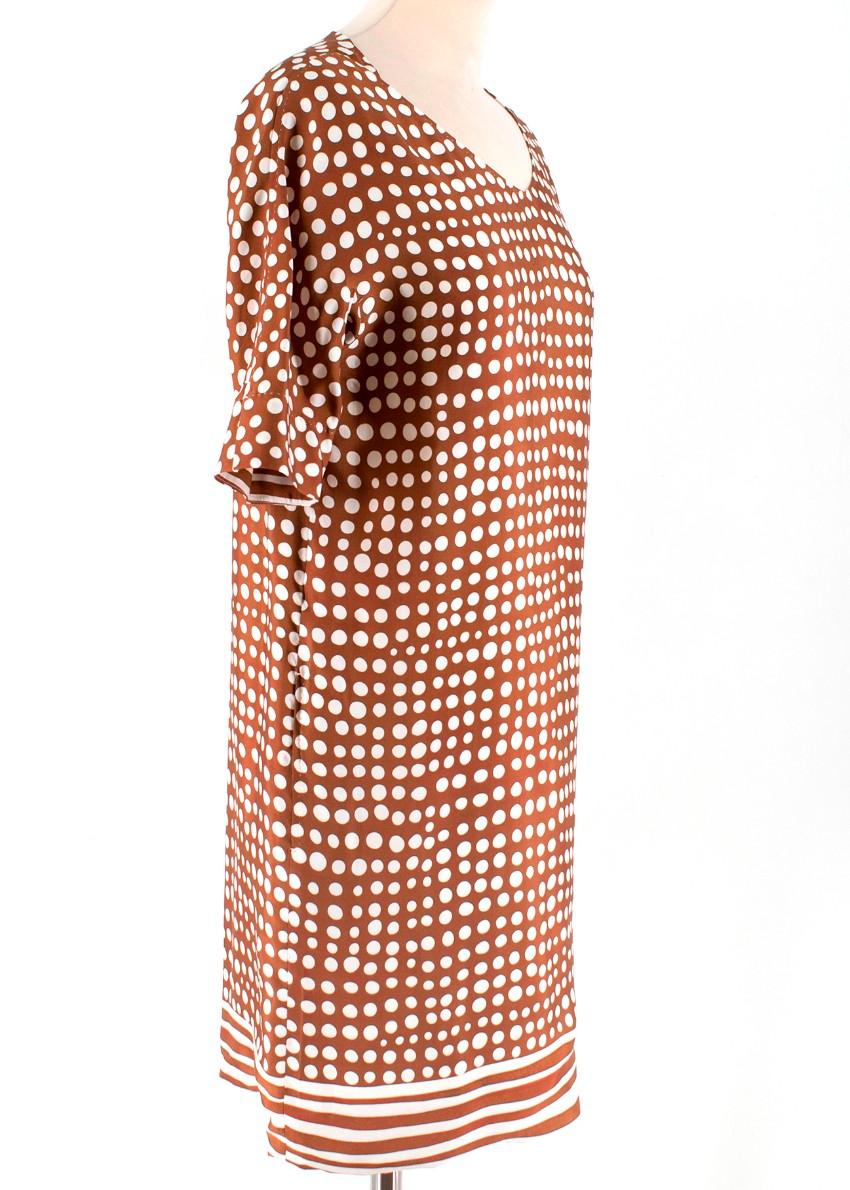 Brown and White Polka dot. mini day dress. 
100% Silk. 
Pocket detail on both sides. 
Made In Italy.

Please note, these items are pre-owned and may show signs of being stored even when unworn and unused. This is reflected within the significantly