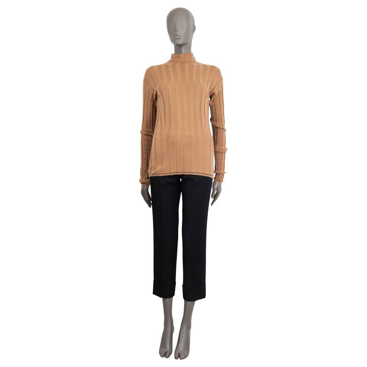100% authentic Loro Piana long sleeve turtle neck top in camel cashmere (100%). Embellished with blue and grey seams on alongside the hemline, the turtle neck and the cuffs. Unlined. Has been worn and is in excellent condition.

Measurements
Tag