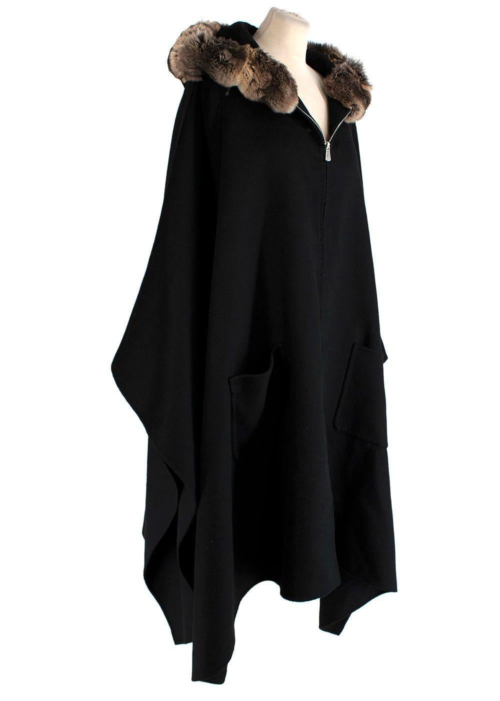 Black Loro Piana cashmere cape with chinchilla fur, dual patch pockets at sides and hidden zip closure at center front. One size

100% Cashmere; Trim 100% Chinchilla


Length 39.5 inches / 101 cm (from shoulder)


Width 139 cm / 54.7 inches
