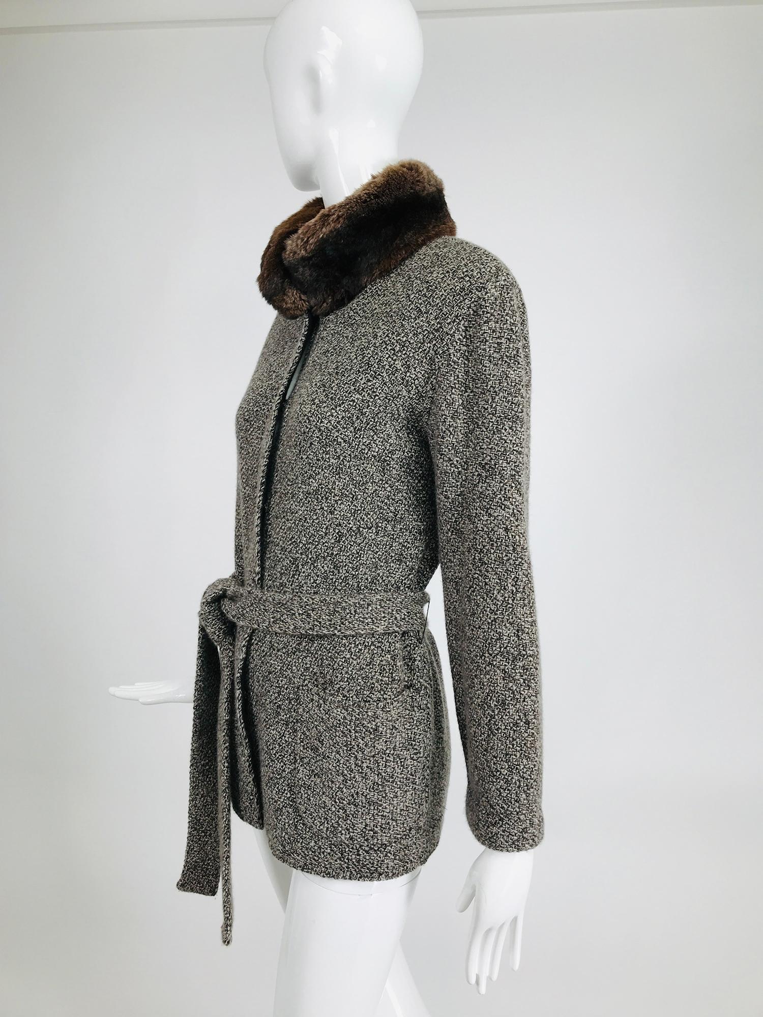 Loro Piana cashmere tweed belted sweater jacket with chinchilla collar. Knitted cashmere tweed in shades of brown & grey, the jacket closes at the front with large hidden, covered snaps, hip front patch pockets and long sleeves. The sweater comes