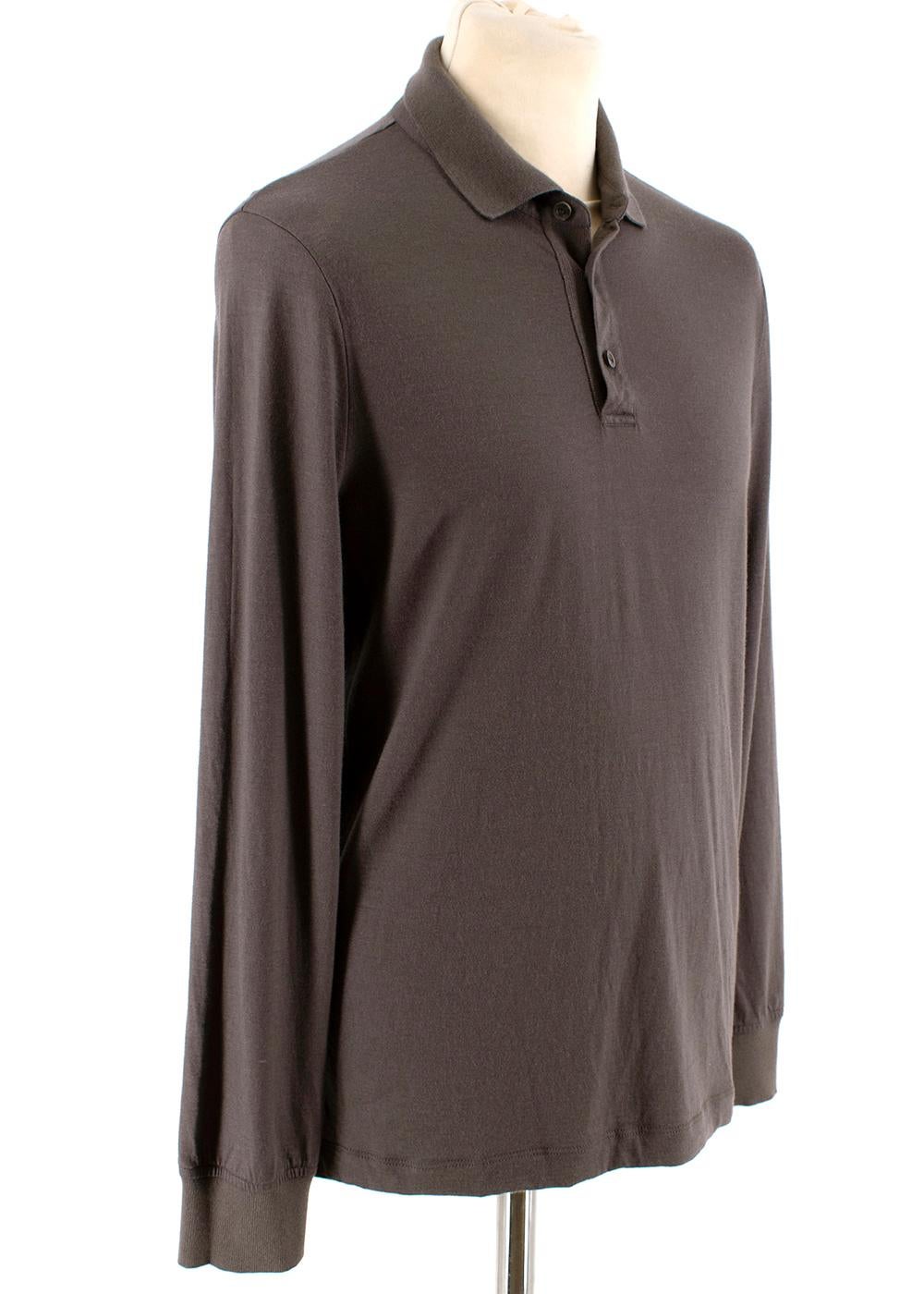 Loro Piana Chocolate Cashmere Knit Polo

- Lightweight
- Subtle heathered coloring 
- Relaxed collar
- Loose fit

Materials:
100% Cashmere

Made in Italy
Professional dry clean only

Measurements:
Approx. 
Shoulders 40cm
Sleeves 62cm
Chest