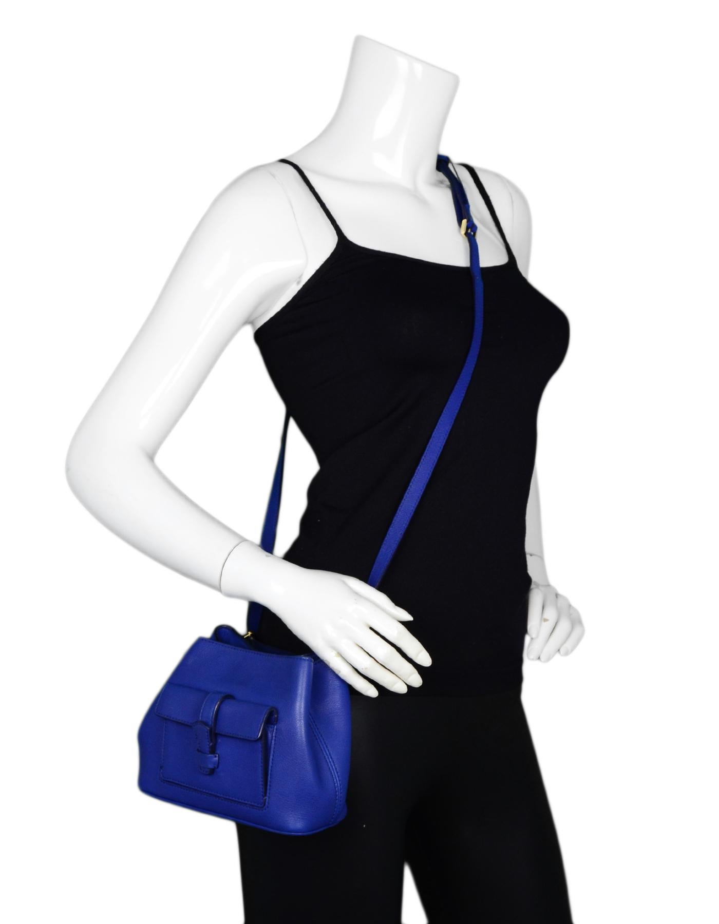 Loro Piana Cobalt Blue Leather Globe Bandouliere Crossbody Bag

Made In: Italy
Color: Cobalt blue
Hardware: Goldtone
Materials: Leather
Lining: Blue leather
Closure/Opening: Snap closure
Exterior Pockets: Front facing pocket with slide through