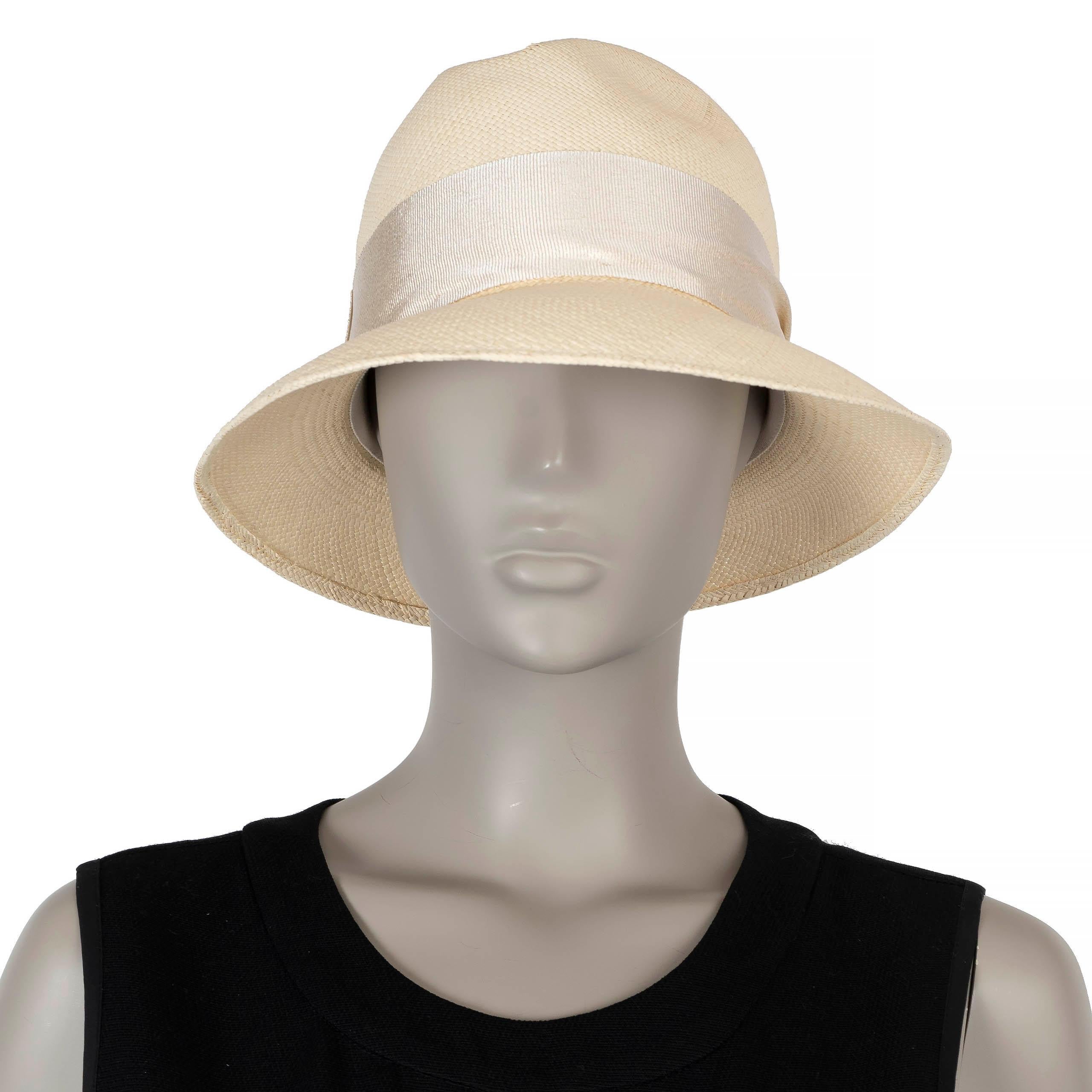 This 100% authentic Loro Piana Mia Panama hat is crafted from cream straw and features a tonal grosgrain band for a refined look. It is accented with a silver-tone logo-engraved eyelet, offering a subtle yet elegant detail. Perfect for adding a