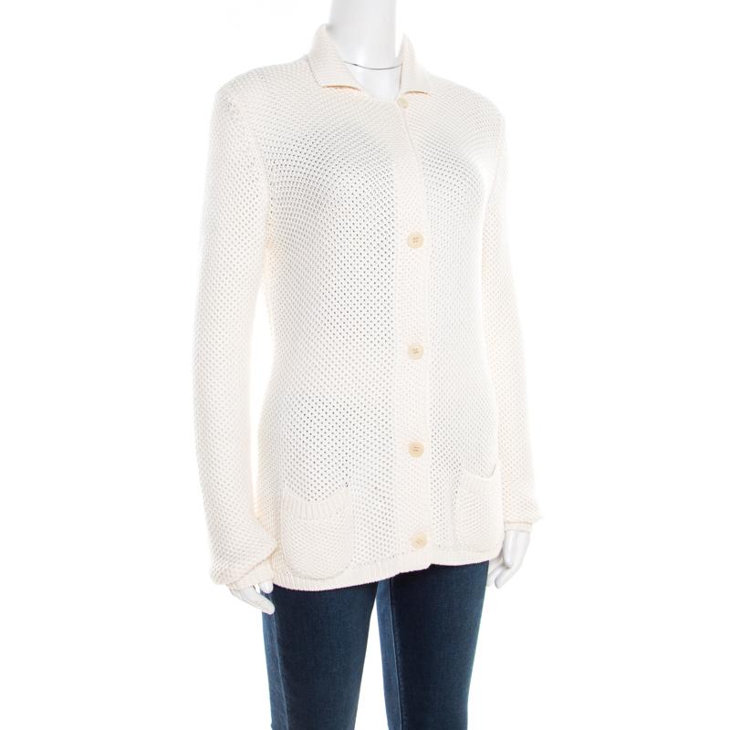 Modishly designed with a feminine approach, this Loro Piana cardigan is crafted in a silk and cotton blend. This snug piece has long sleeves and button front closure. This pretty cream cardigan will be an ideal addition to your closet.

Includes: