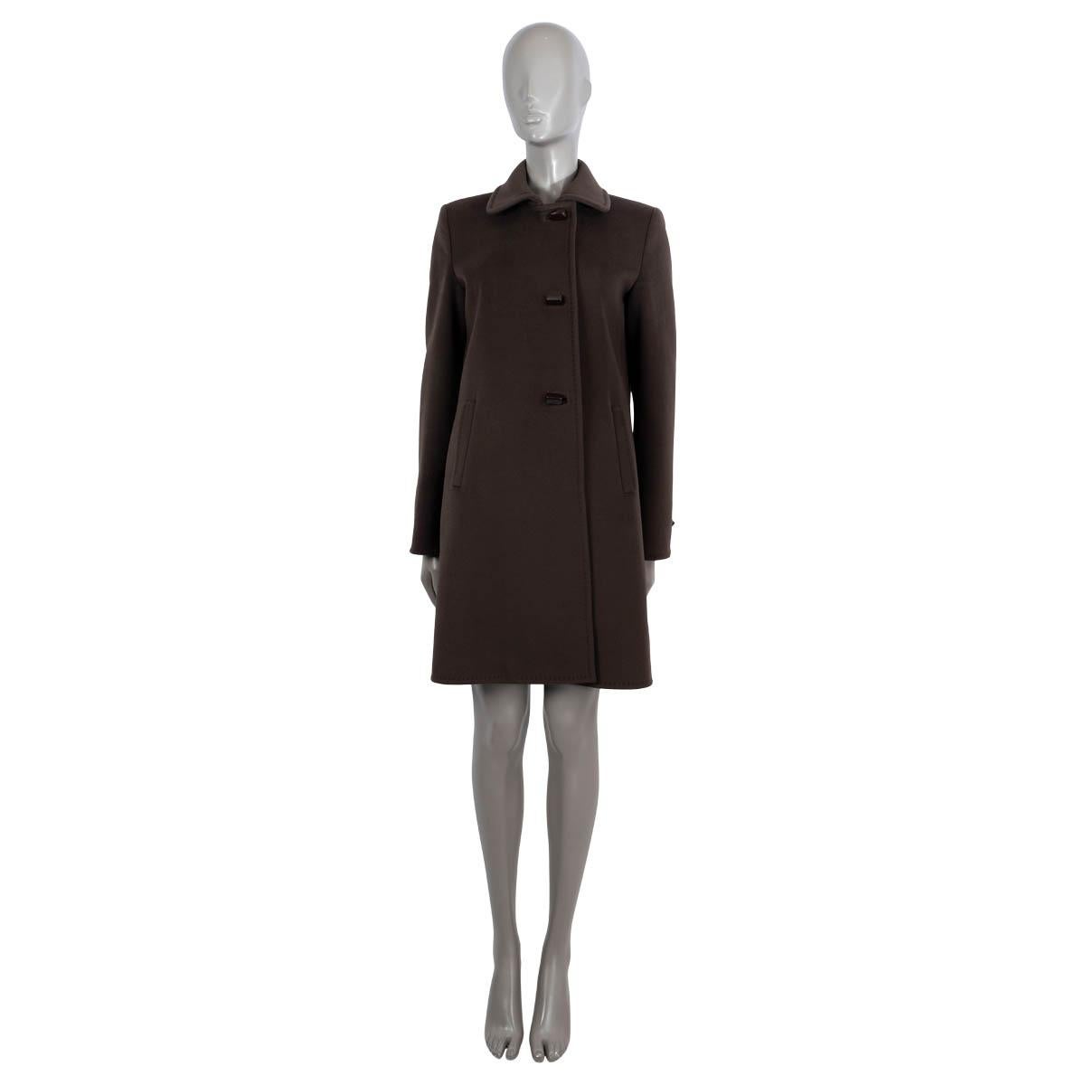 100% authentic Loro Piana single-breasted coat in chocolate brown cashmere (assumingly - please note content tag is illegible). Features top-stitching details and two slant pockets at the waist. Closes with gunmetal toggle-style buttons. Lined in