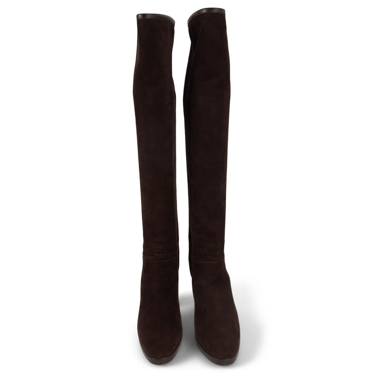 100% authentic Loro Piana Thador knee high boots in brown suede with brown leather trim. The design features a stacked heel and platform. Lined in brown cashmere. Have been worn and are in excellent condition. 

Measurements
Imprinted Size	37.5
Shoe