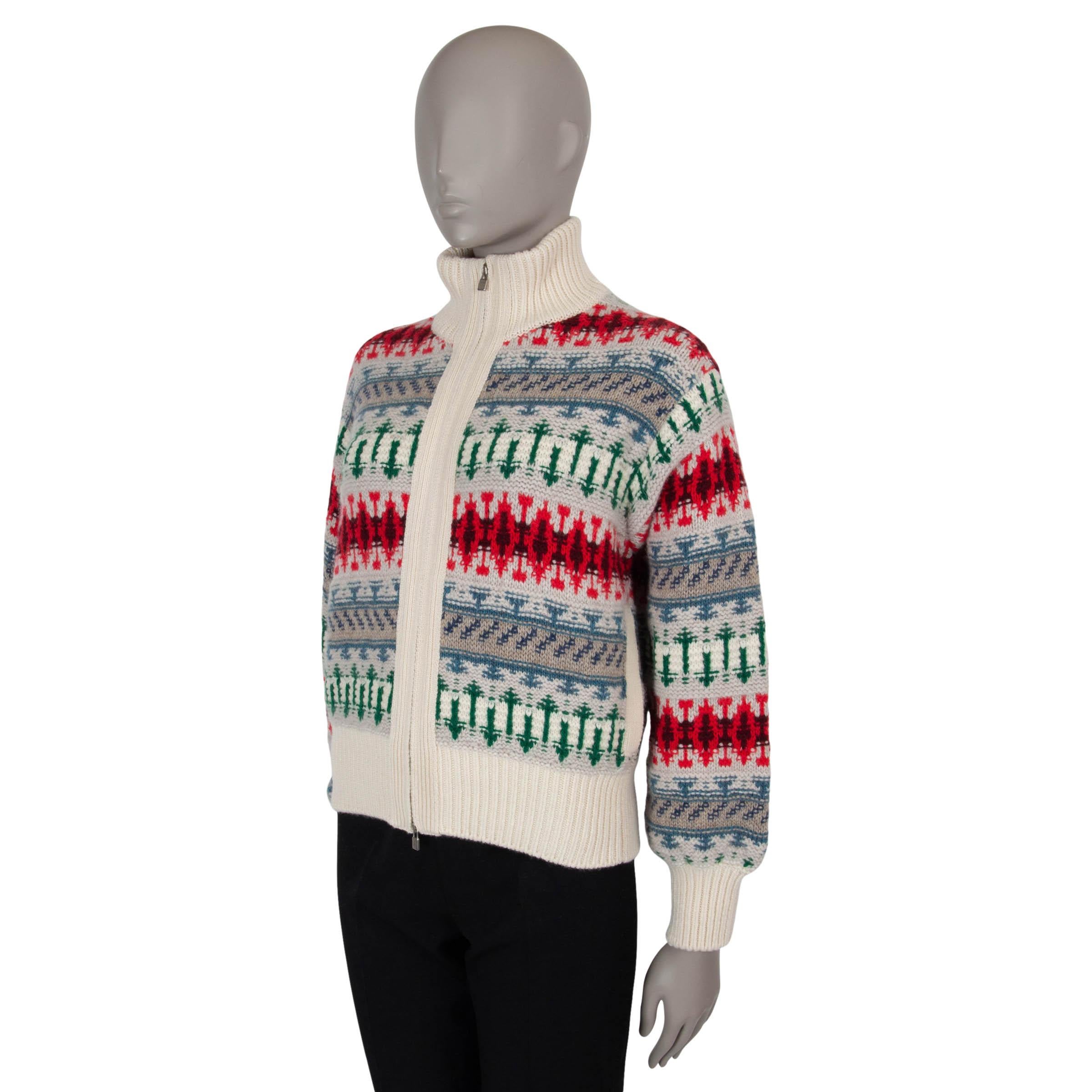 This 100% authentic Loro Piana Holiday Noel knit bomber in cream cashmere (100%) showcases a festive Fair Isle jacquard in blue, red, and green. Designed with a relaxed fit, it features dropped shoulders, two slant pockets, a rib-knit mock neck, and