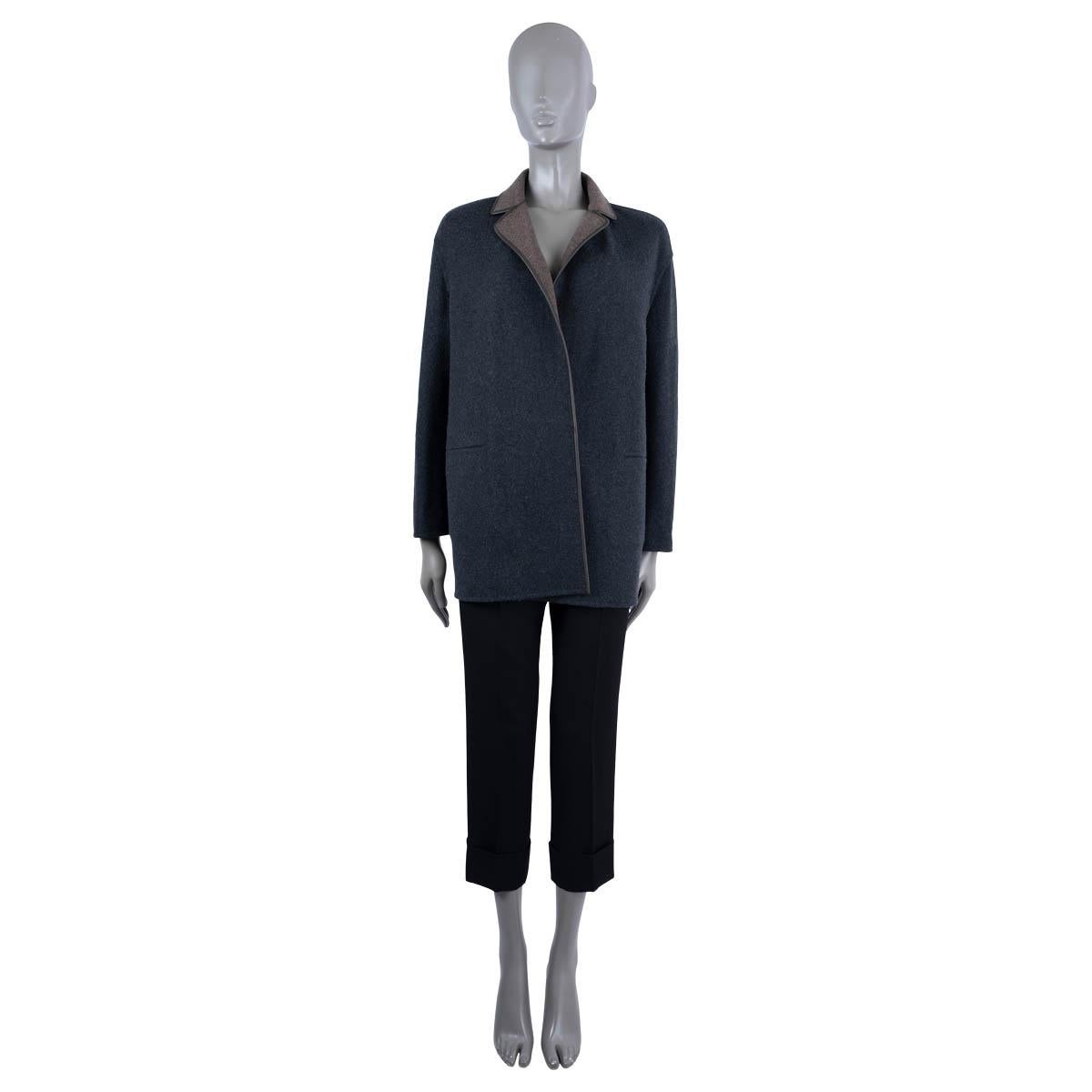 100% authentic Loro Piana Jimi reversible jacket in cashmere (with 4% polyamide) in charcoal grey on one side and brown on the other. Features dark brown leather trim and belt, as well as two pocket on each side. Has been worn and is in excellent
