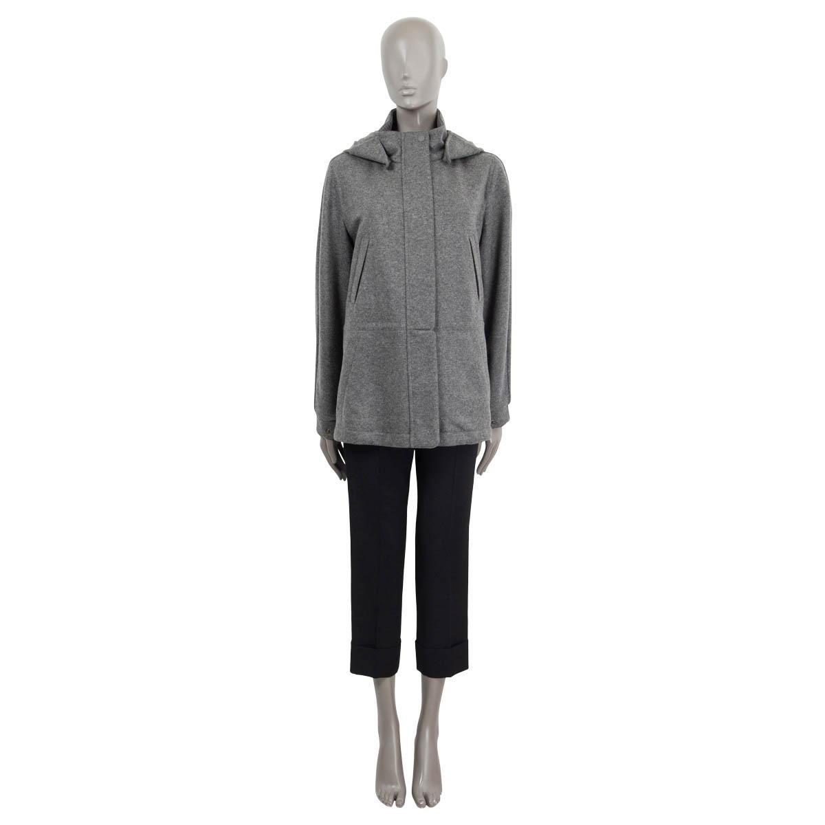 100% authentic Loro Piana 'Icery' hooded knit jacket in grey melange cashmere (100%) treated with waterproof, wind-resistant Storm System. Features four slit pockets on the front and a concealed drawstring at the waist. Closes with a zipper and