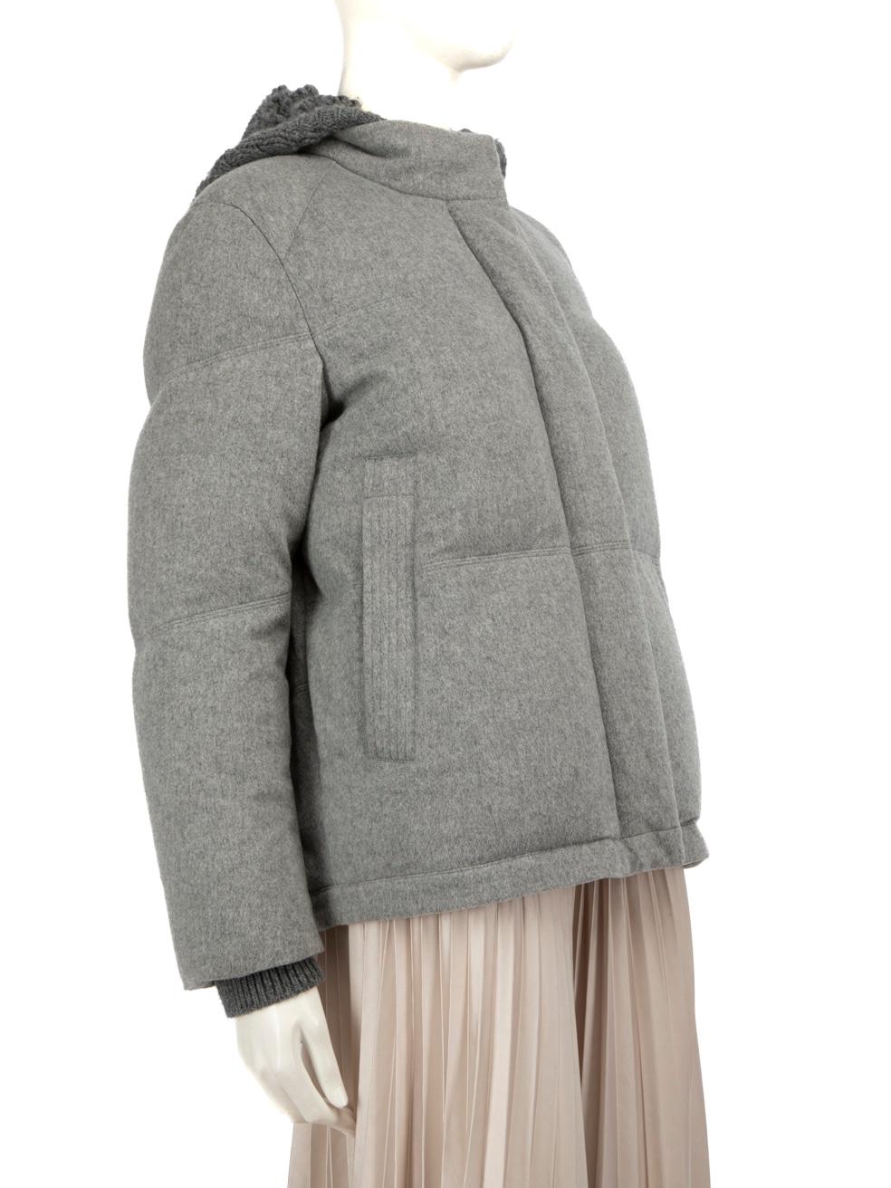 CONDITION is Good. General wear to the coat is evident. There is a mark on the back of the coat on the top panel, on the lining near the brand label and to the left side near the underarm lining of this used Loro Piana designer resale item.
 
