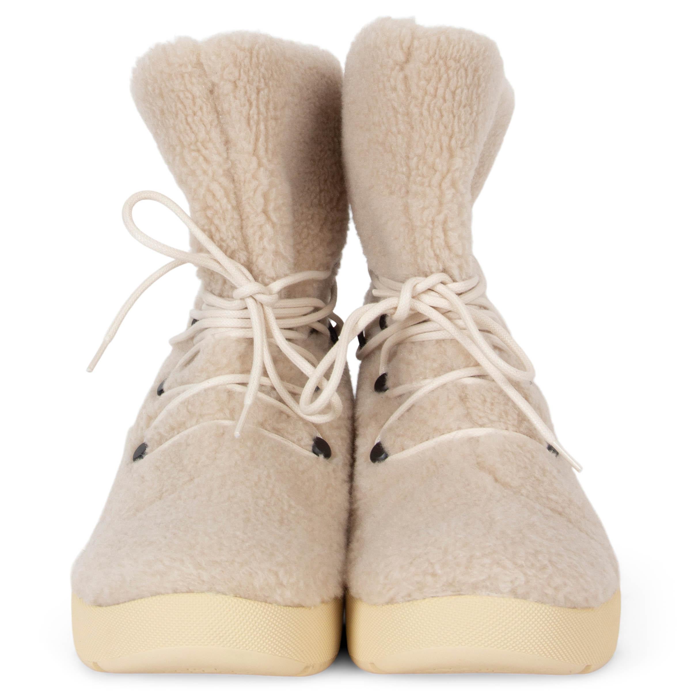 These 100% authentic Loro Piana Trace classic hiking boots offer a perfect blend of style and practicality, making them ideal for the Autumn/Winter season. Featuring sporty soles and laces around the ankles, they provide both functionality and