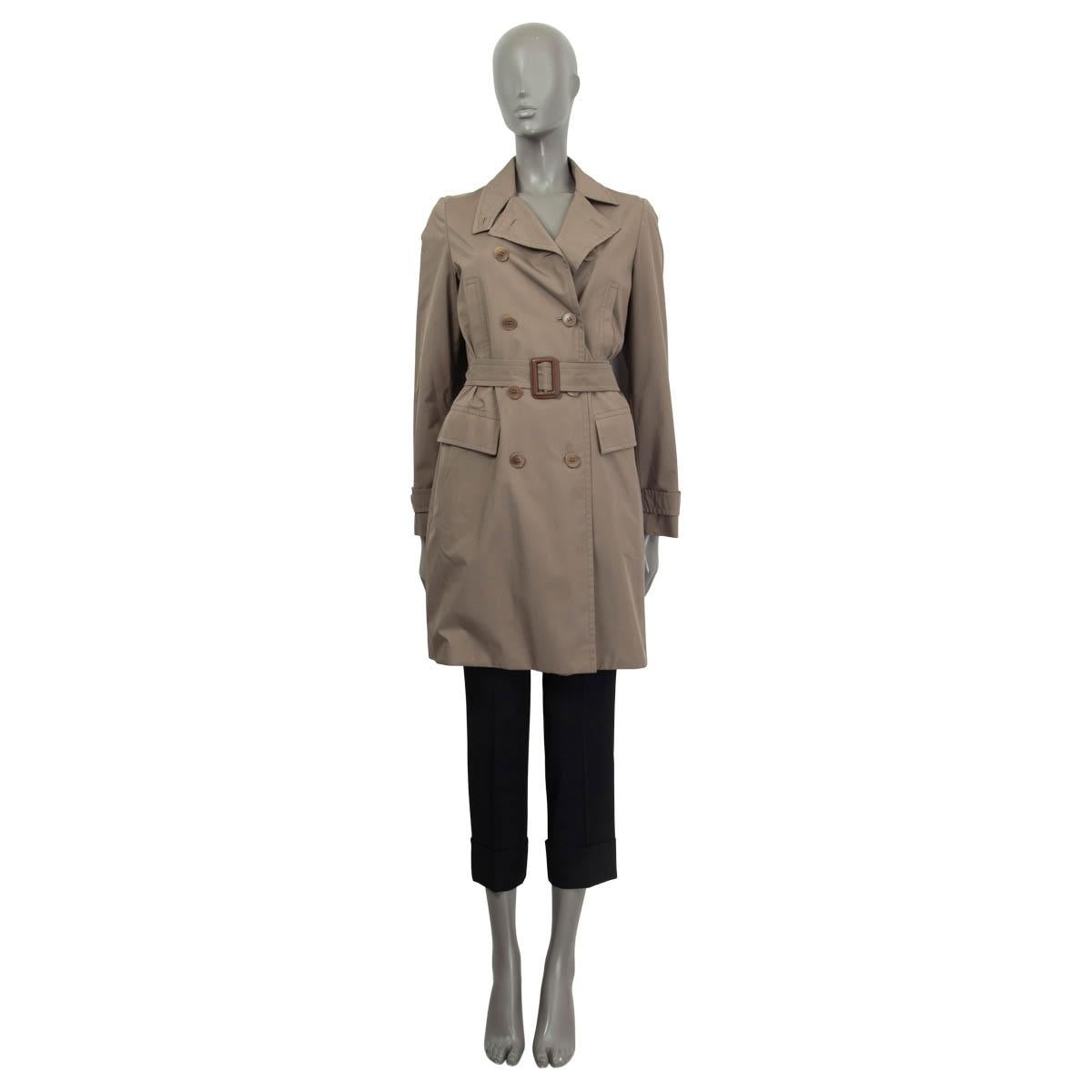 100% authentic Loro Piana double breasted trench coat in khaki polyester (80%) and polyurethane (20%). Features a belt, two flap pockets and one slit pocket on the front. Has buttoned cuffs and a notch collar. Opens with four khaki buttons on the