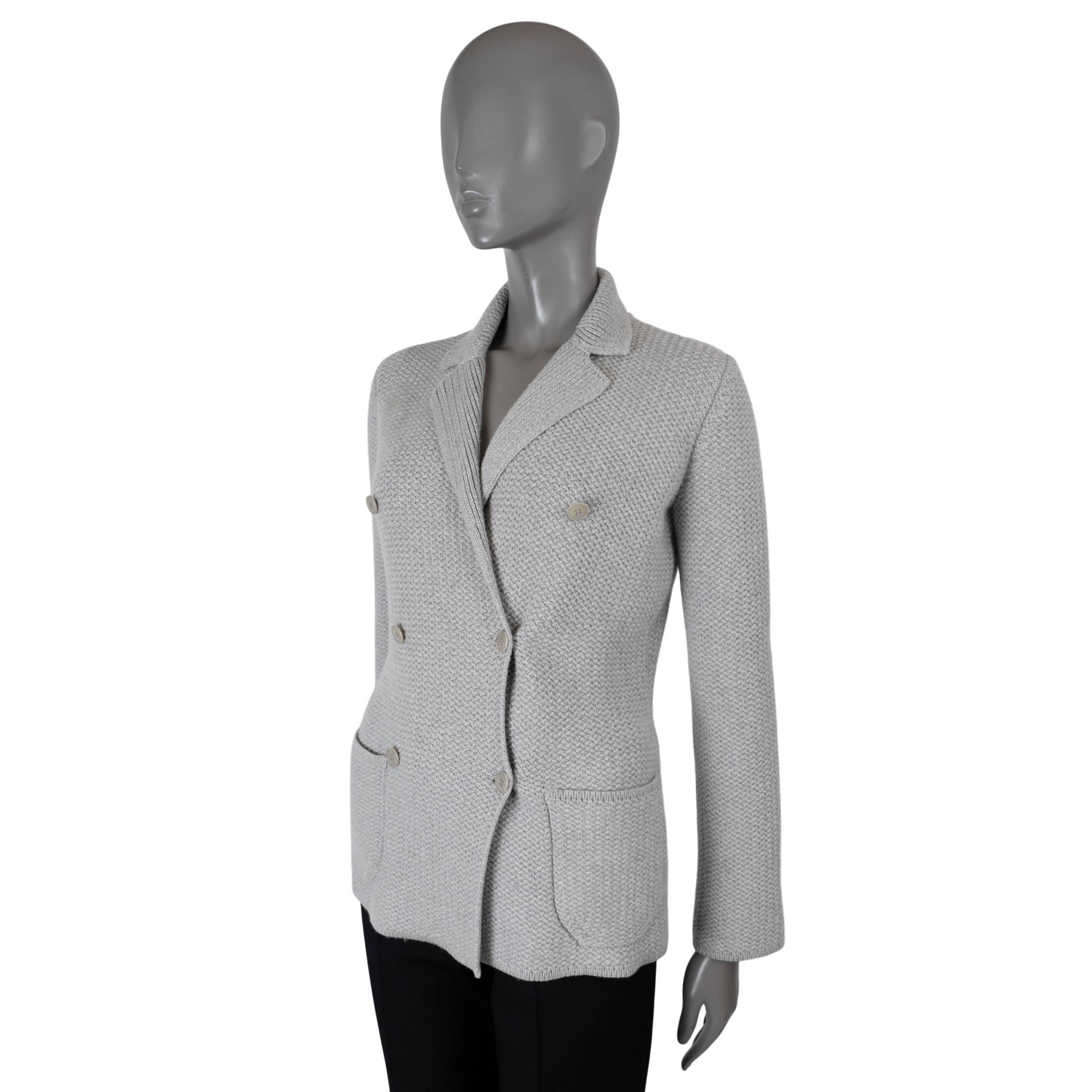 100% authentic Loro Piana double-breasted knit jacket in light grey cashmere (100%). Features notched lapels and two patch pockets at the waist. Closes with matte silver-tone buttons and is unlined. Has been carried and is in excellent