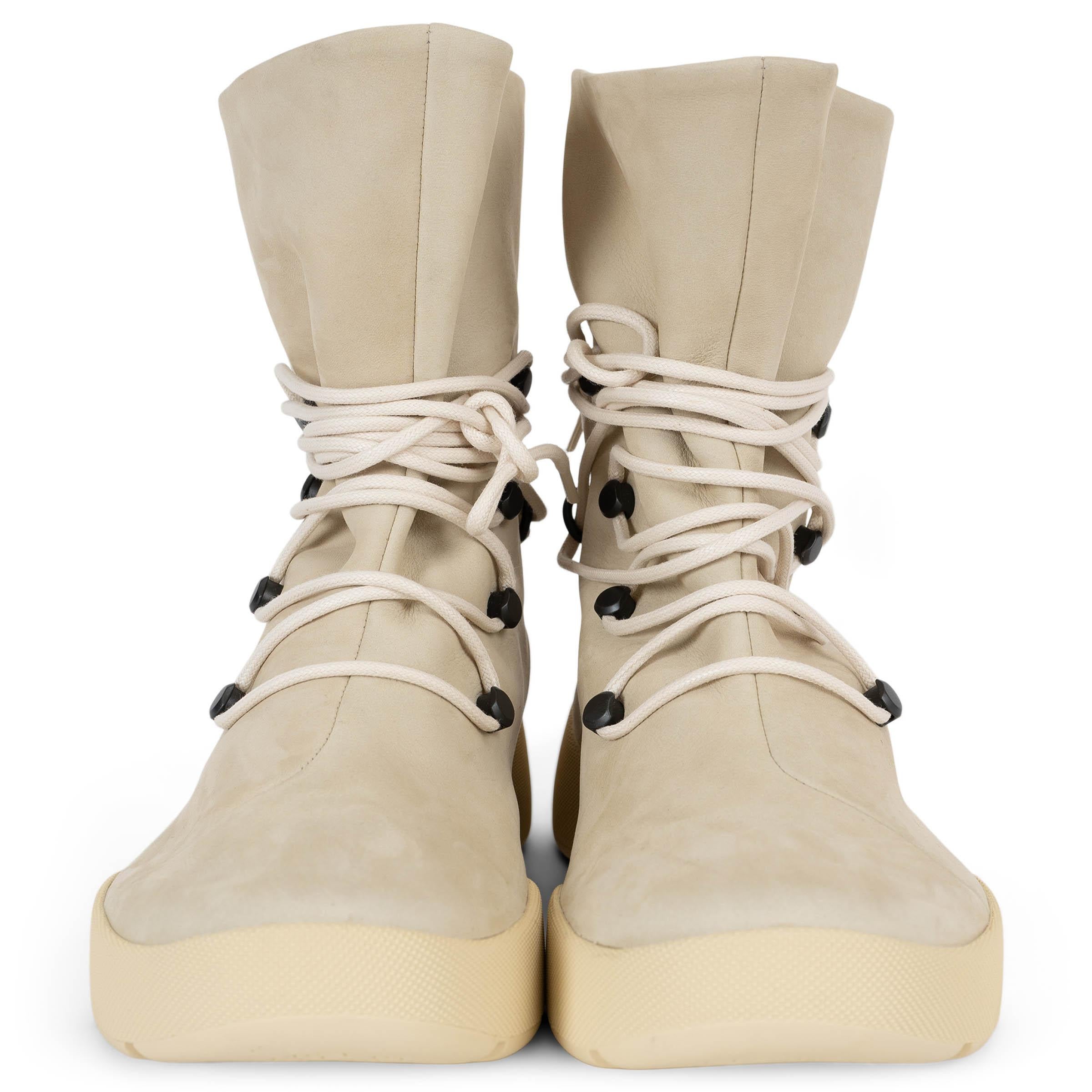 This 100% authentic Loro Piana Trace boots in beige nubuck blend rugged functionality with refined craftsmanship. Treated with a water-repellent and stain-proof finish, they are designed for durability and effortless style. Featuring round toes,