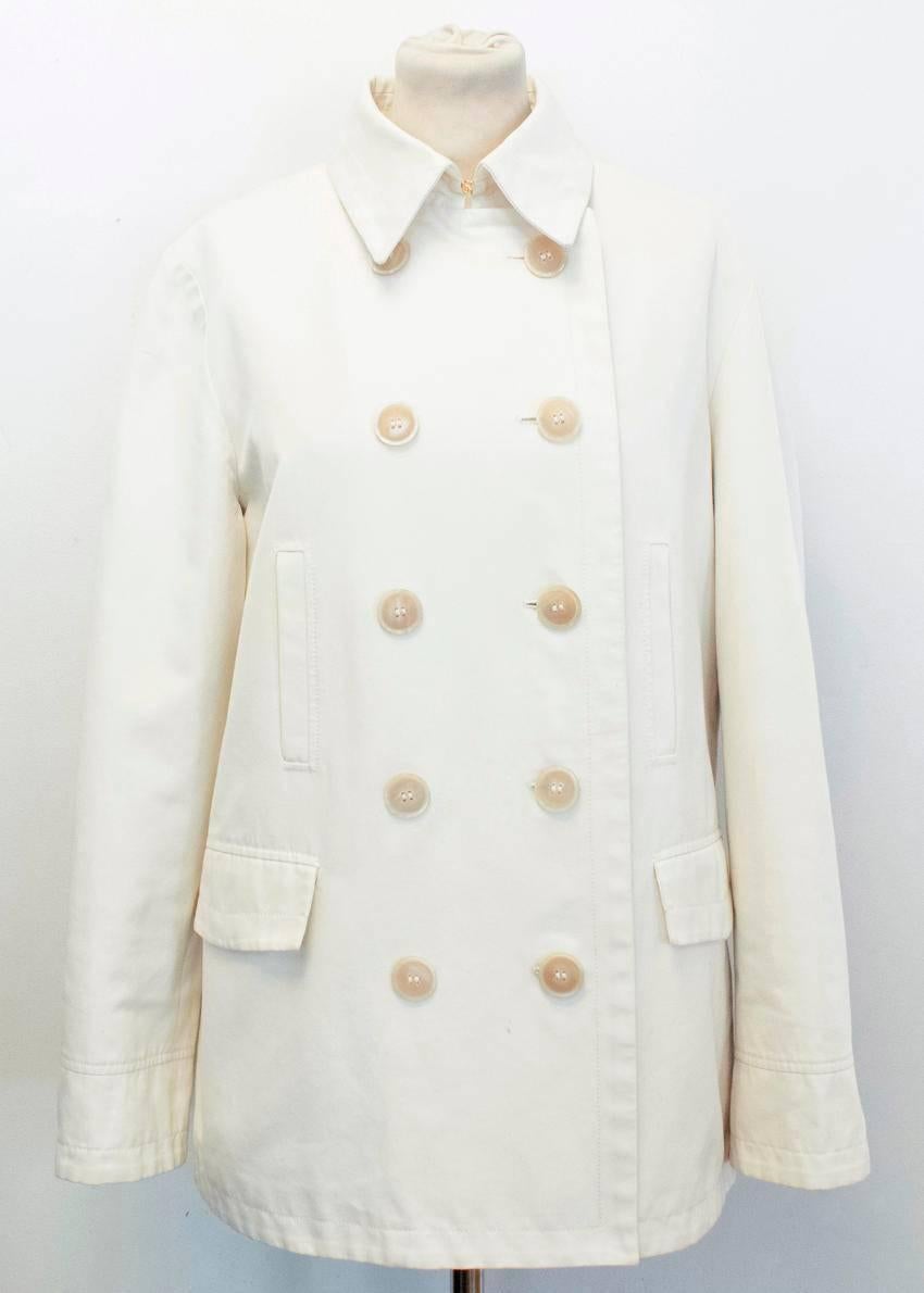 Loro Piana beige double breasted, collared coat with a single vent in the back. Features 5 pairs of buttons on the front and 4 functioning pockets. 

Approx measurements.
Length -77cm 
Shoulders -41cm
Chest -49cm 
Arms -53cm 

EU SIZE 48 
UK SIZE 38