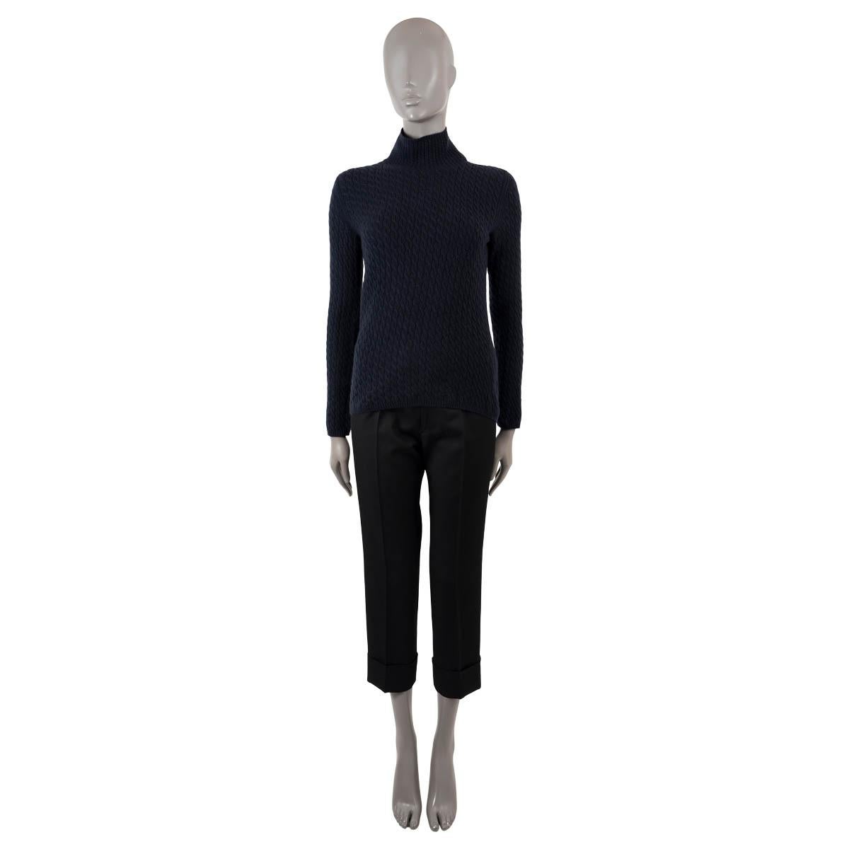 100% authentic Loro Piana cable knit sweater in navy blue cashmere (100%). Features a rib knit mock neck. Unlined. Has been worn and is in excellent condition.

Measurements
Tag Size	44 cut small
Size	S/M
Shoulder Width	35cm (13.7in)
Bust From	92cm