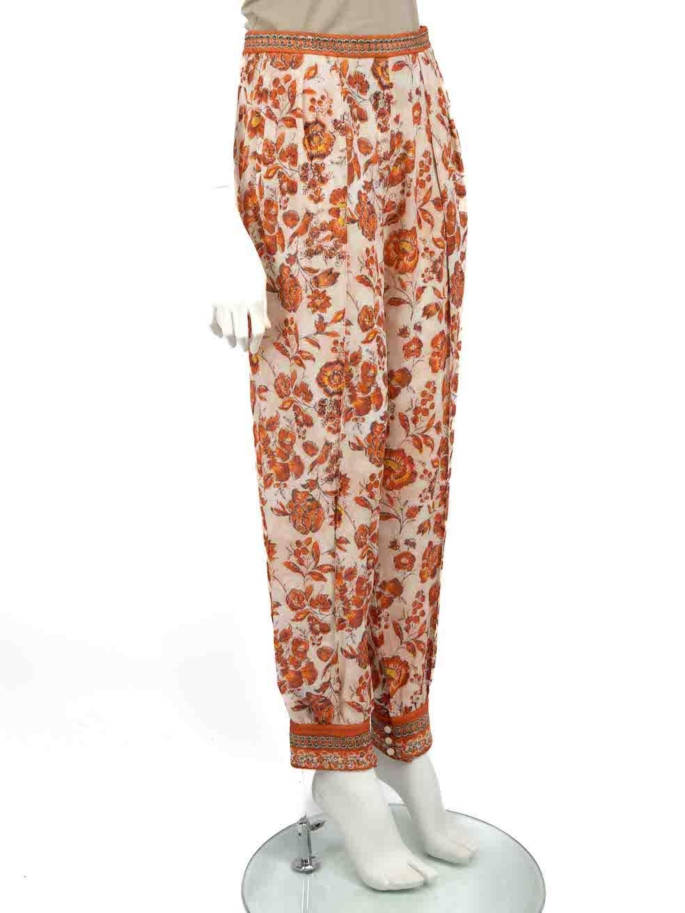 CONDITION is Very good. Hardly any visible wear to trousers is evident on this used Loro Piana designer resale item.
 
 
 
 Details
 
 
 Orange
 
 Silk
 
 Trousers
 
 Floral print
 
 Tapered leg
 
 High rise
 
 Side zip and button fastening
 
 
 
 

