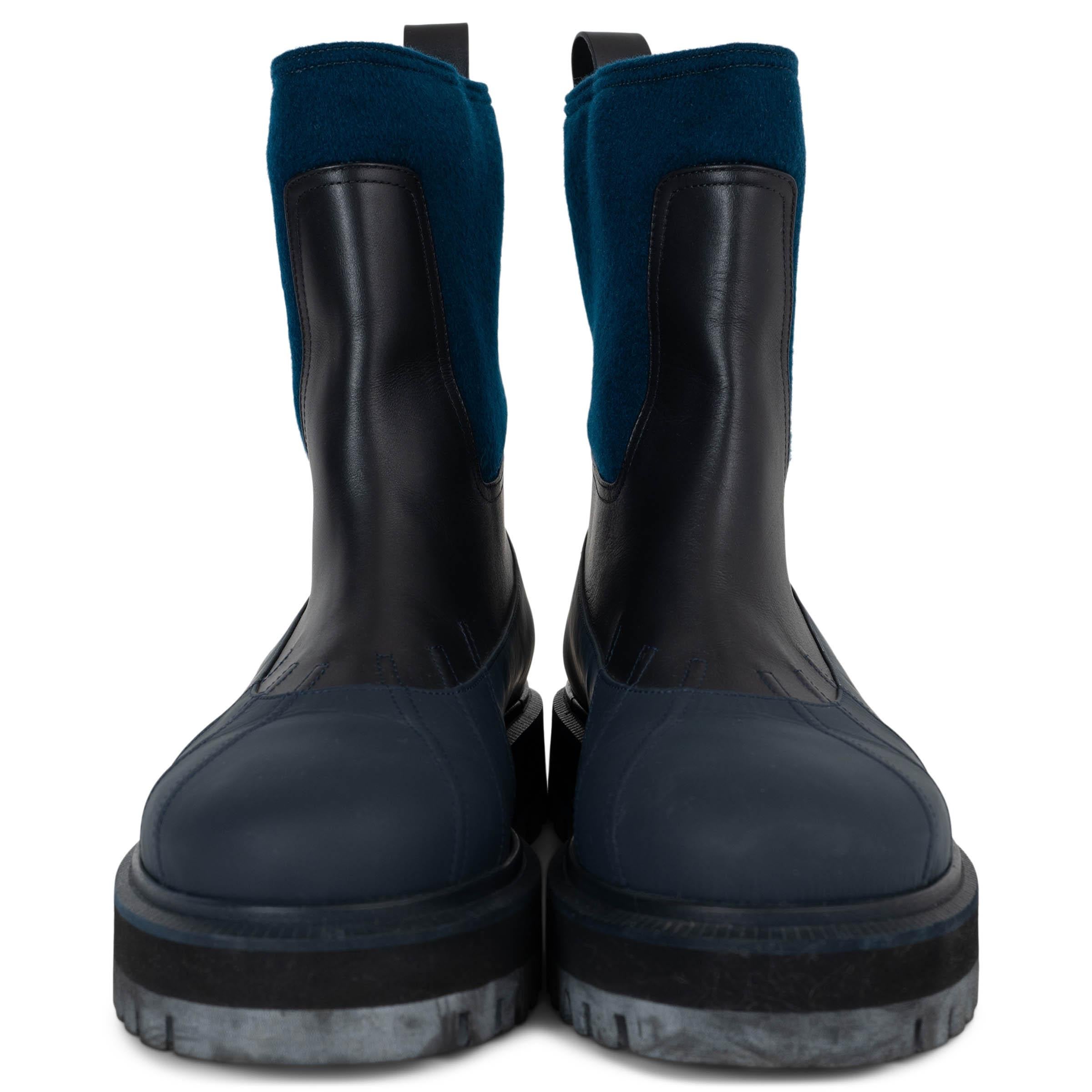 This 100% authentic Loro Piana Regent rain boots combine luxury and functionality with impeccable craftsmanship. Featuring an upper in peacock blue cashmere treated with Storm System® for water resistance, they are accented with midnight blue