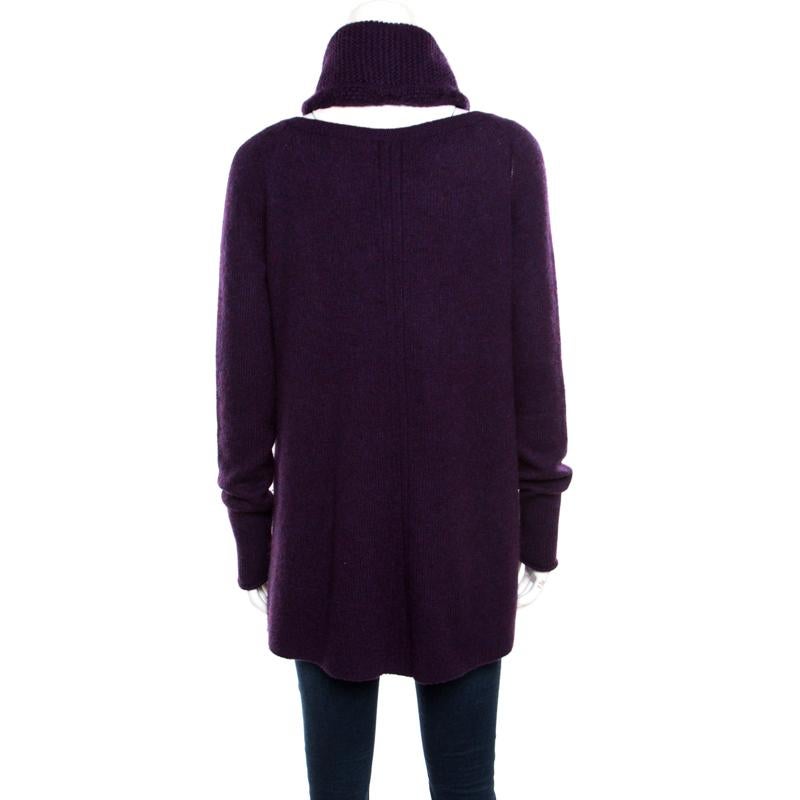 Plush and warm, this sweater by Loro Piana is made from luscious cashmere, flaunting a feminine purple hue. It is styled with long sleeves and a round neckline accompanied by a matching Infinity scarf. Fine knitting and a smooth finish complete this