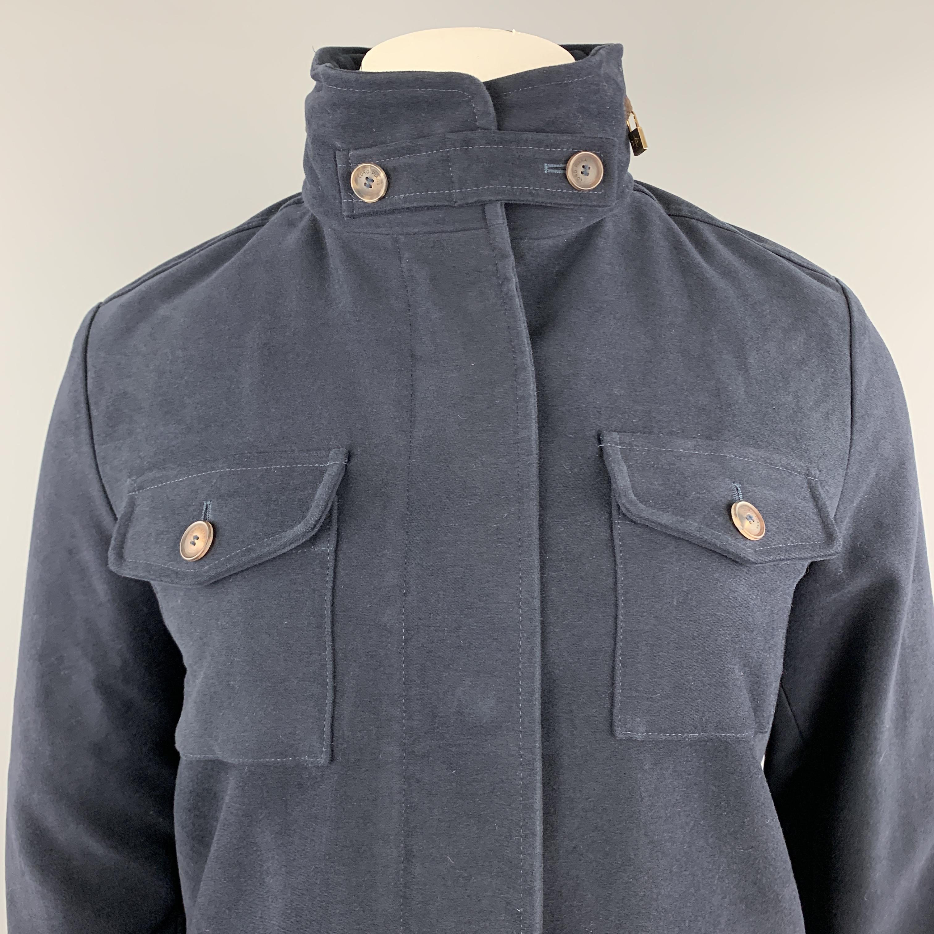 LORO PIANA jacket comes in navy cotton with a high button collar, hidden placket front, patch flap pockets, and zi pout hood with suede trim. Made in Italy.

Excellent Pre-Owned Condition.
Marked: IT 44

Measurements:

Shoulder: 18 in.
Bust: 44
