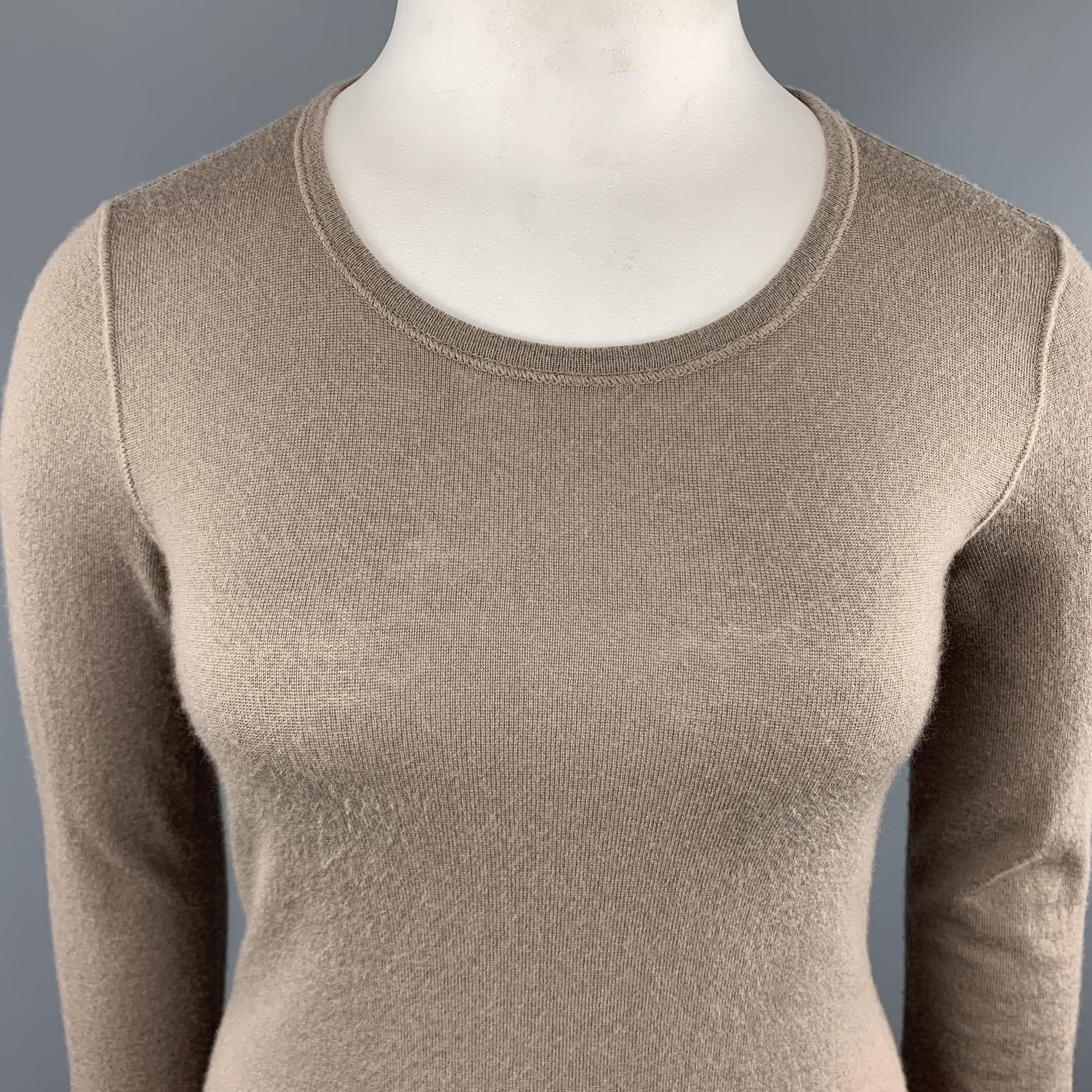 LORO PIANA long sleeve pullover sweater comes in a taupe beige sheer cashmere knit with a round neckline. Made in Italy.
 

Very Good Pre-Owned Condition.
Marked: IT 46

Measurements:

Shoulder: 15 in.
Bust: 38 in.
Sleeve: 26 in.
Length: 27.5 in.