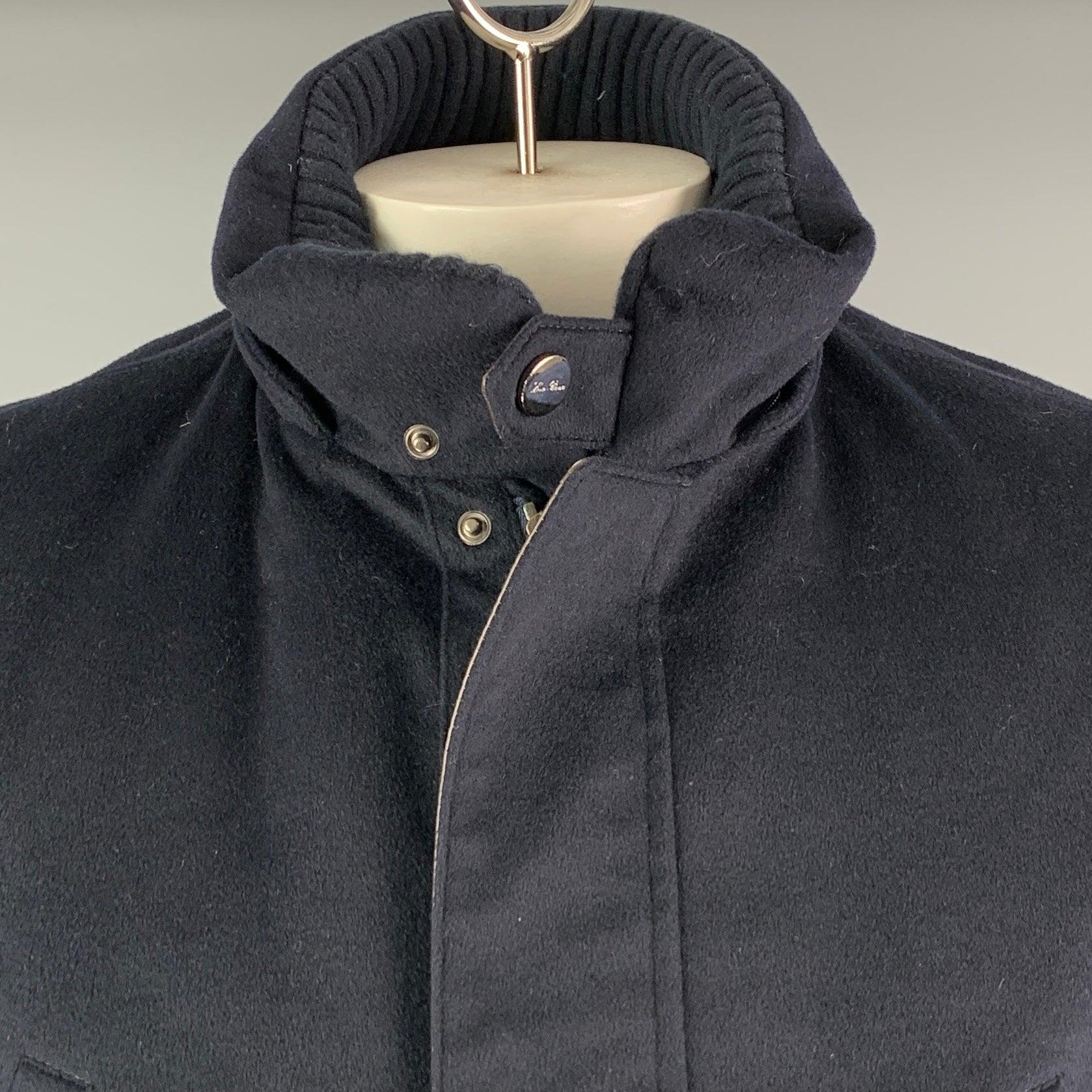 LORO PIANA jacket
in a
navy cashmere fabric featuring detachable hood, brown leather trim and drawstring pull details, and zip & snaps closure. Made in Italy.Very Good Pre-Owned Condition. Minor signs of wear on snaps. 

Marked:   L 

Measurements: