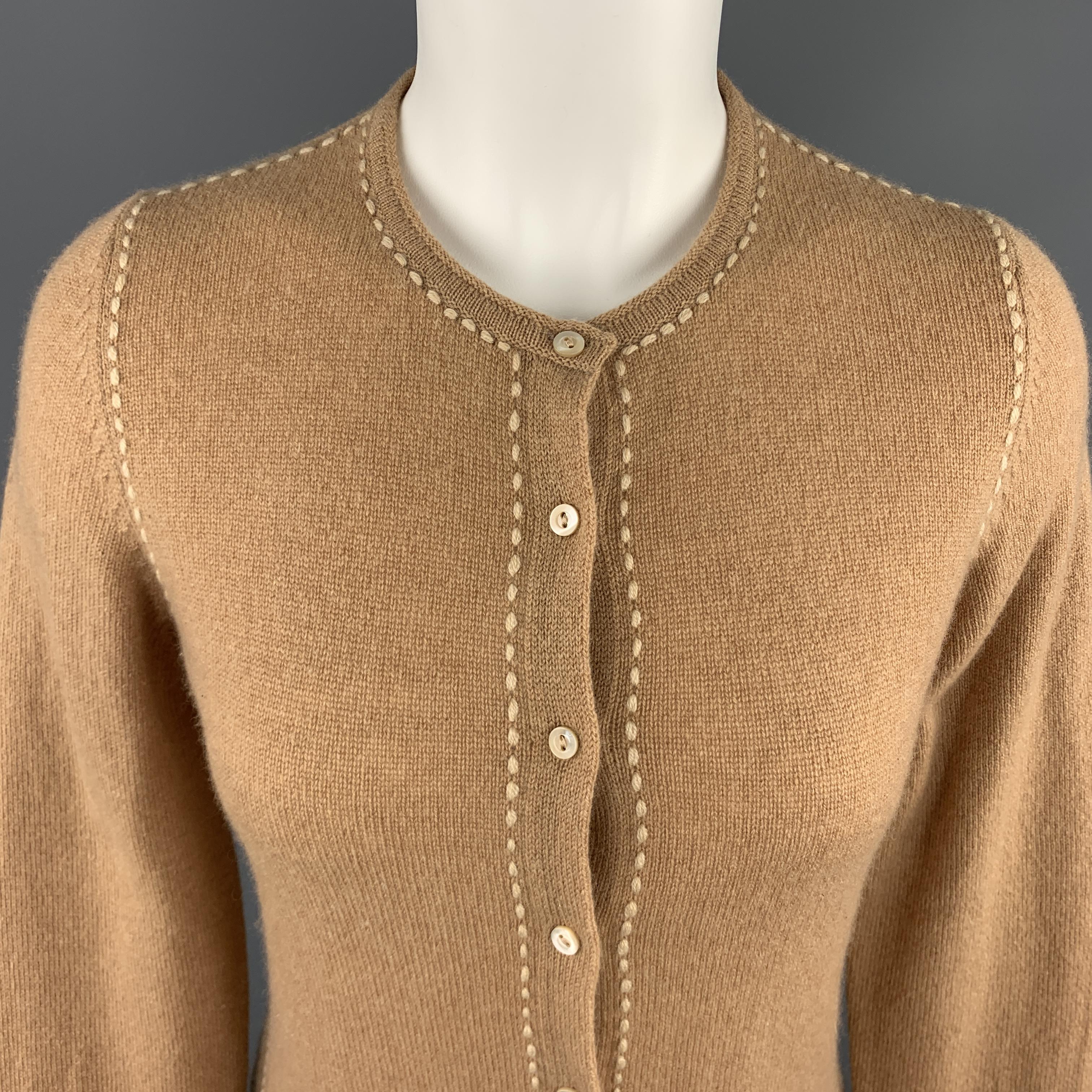 LORO PIANA cardigan comes in tan cashmere with a button front and contrast stitching. Matching Vest available separately. Made in Italy.

Excellent Pre-Owned Condition.
Marked: IT 44

Measurements:

Shoulder: 14 in.
Bust: 34 in.
Sleeve: 23