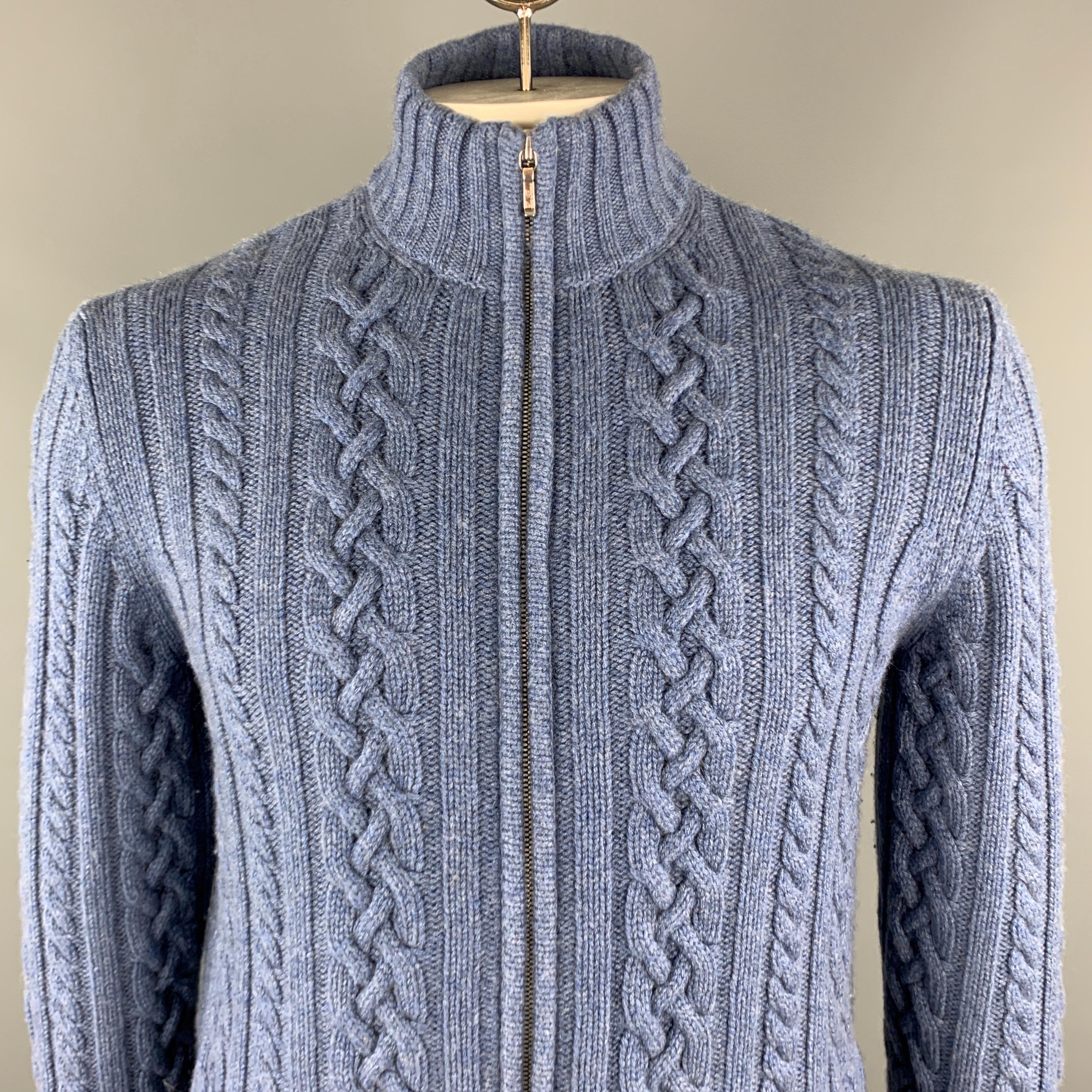 LORO PIANA Cardigan Sweater comes in a blue cable knit cashmere material, with a high collar, zip up, with slit pockets and ribbed collar, cuffs and hem. Made in Italy.


Excellent Pre-Owned Condition.
Marked: IT 52

Measurements:

Shoulder: 16.5