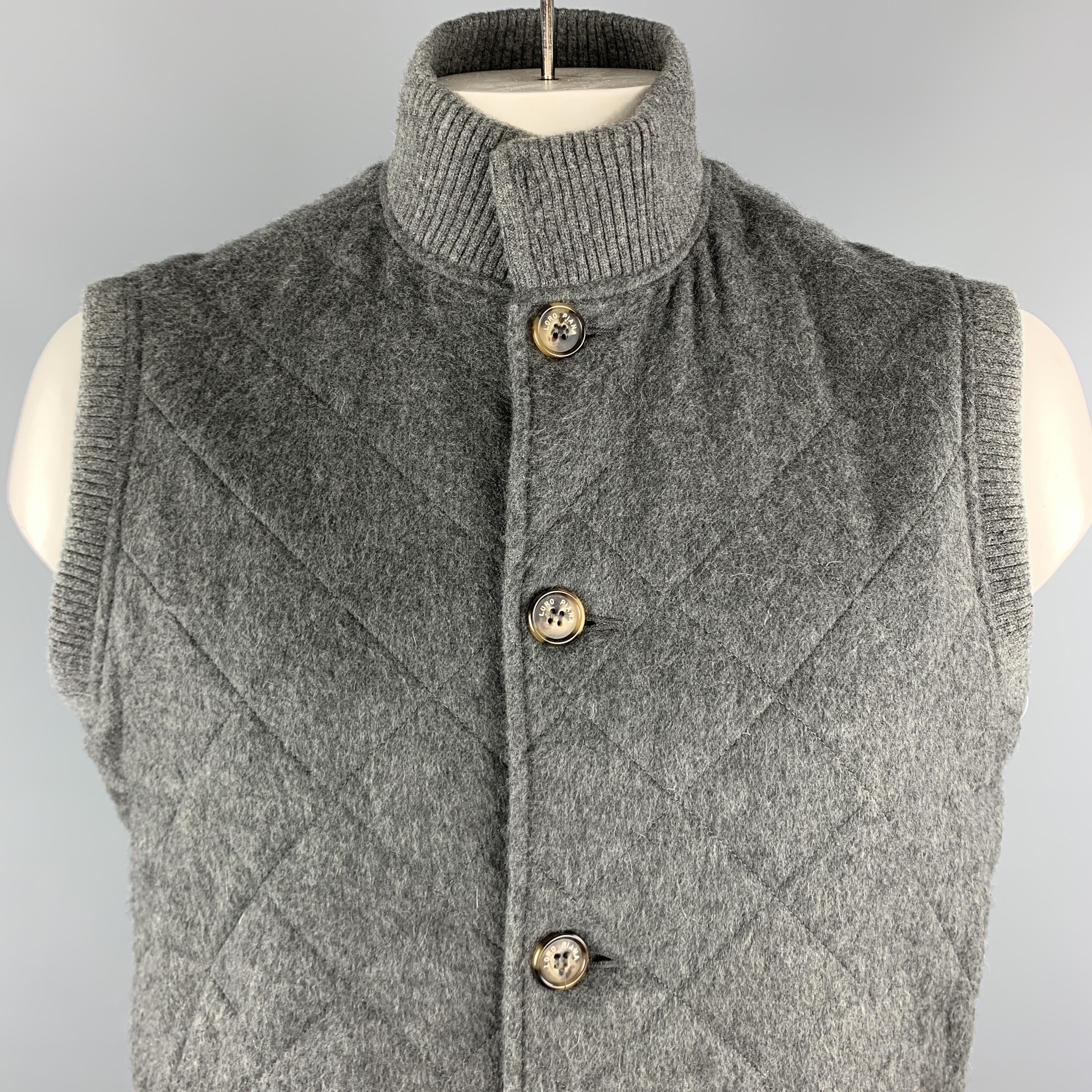 LORO PIANA Vest comes in a gray quilted cashmere material, with a high collar, buttoned closure, decorative buttons at collar, slit pockets, and ribbed collar, cuffs and hem. Made in Italy.

Excellent Pre-Owned Condition.
Marked: L

Original Retail
