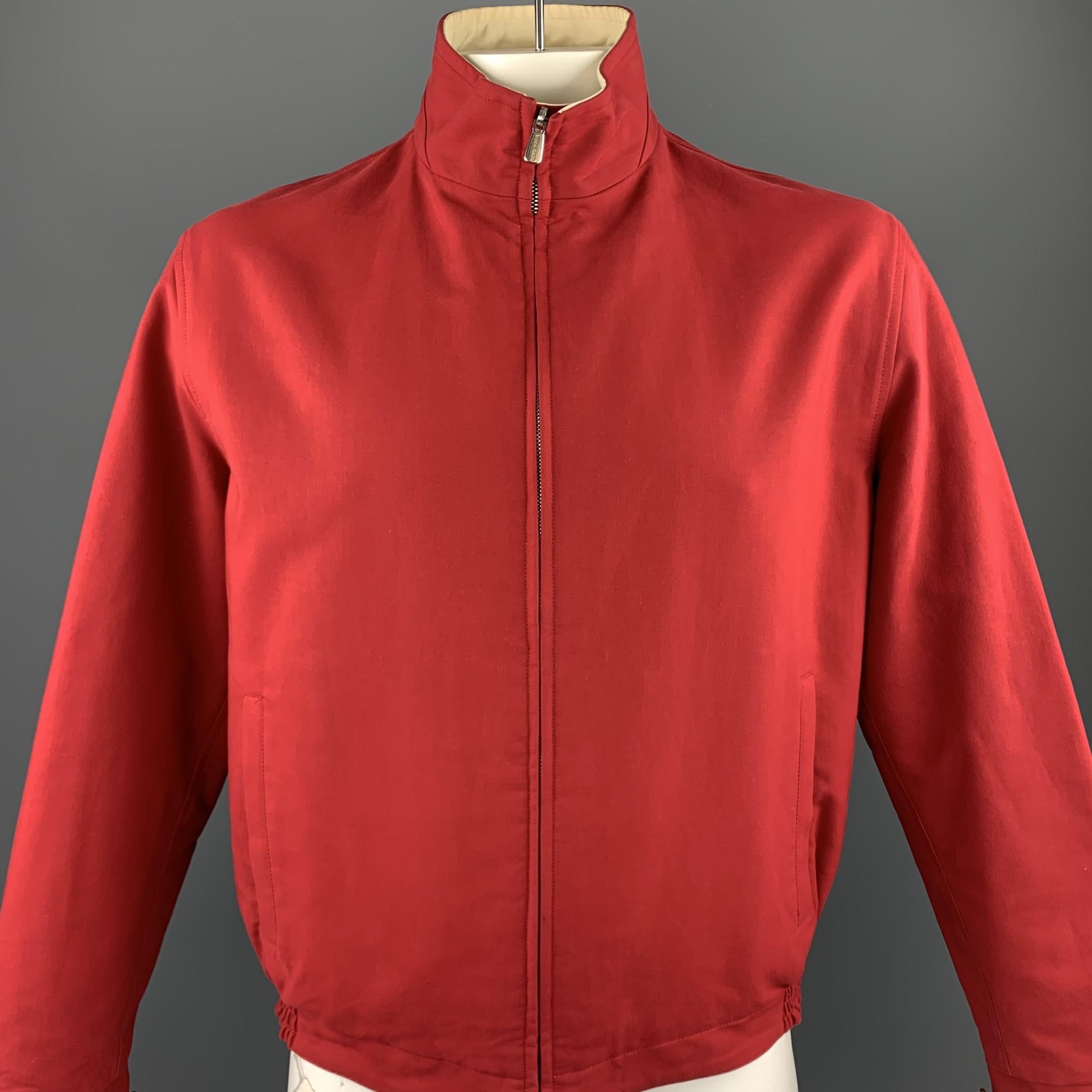 LORO PIANA jacket comes in a red & beige cotton featuring a reversible style, high collar, and a zip up closure. Made in Italy.

Good Pre-Owned Condition.
Marked: IT L

Measurements:

Shoulder: 19 in. 
Chest: 47 in. 
Sleeve: 25.5 in. 
Length: 26 in. 