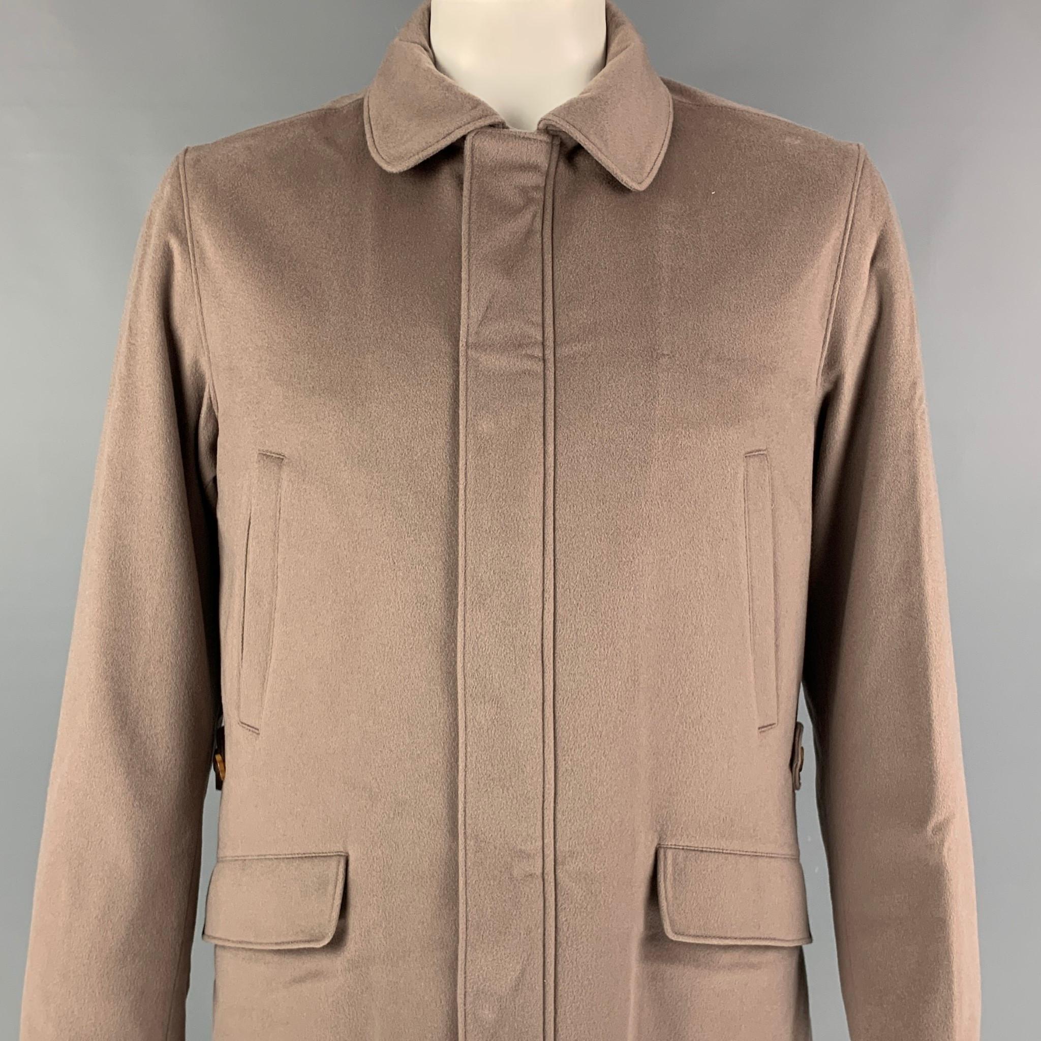 LORO PIANA 'Storm System' jacket comes in a taupe cashmere with a full liner featuring a rain & wind protection, front pockets, double back vent, and a hidden placket closure. Made in Italy. 

New With Tags.
Marked: L
Original Retail Price: