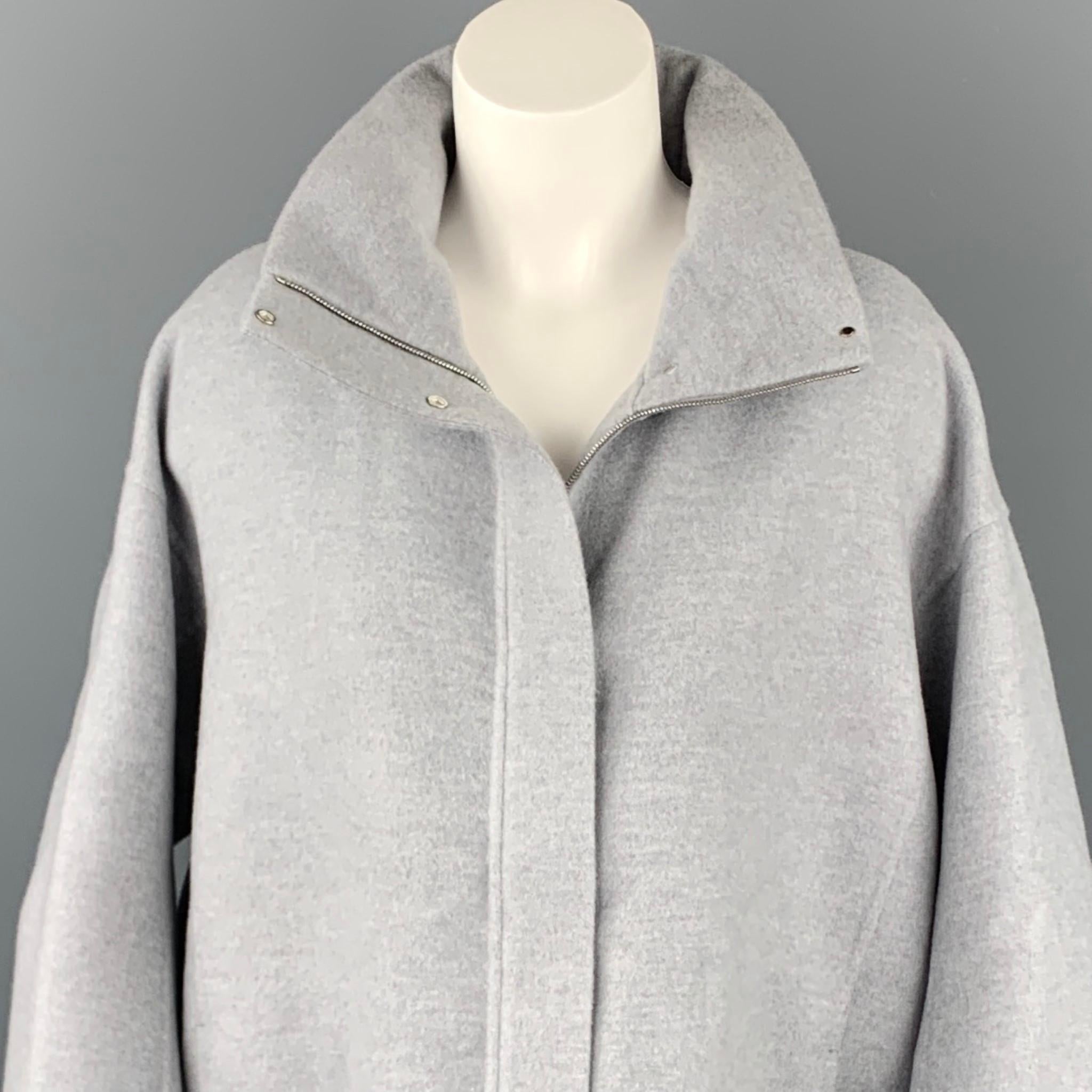 LORO PIANA jacket comes in a light gray cashmere with a leather trim featuring a removable hooded style, oversized, drawstring, slit pockets, and a zip & snap button closure. Made in Italy.

Excellent Pre-Owned Condition.
Marked: