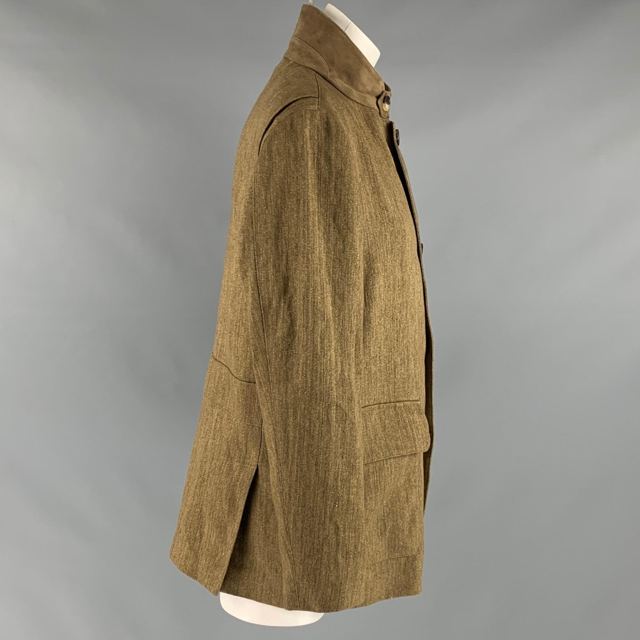 LORO PIANA Giubb Roadster comes in a brown and olive fax herringbone woven material with a full liner featuring a flap pockets, and zip up closure.
 Made in Italy.Excellent Pre-Owned Condition. 

Marked:   S 

Measurements: 
 
Shoulder: 16 inches