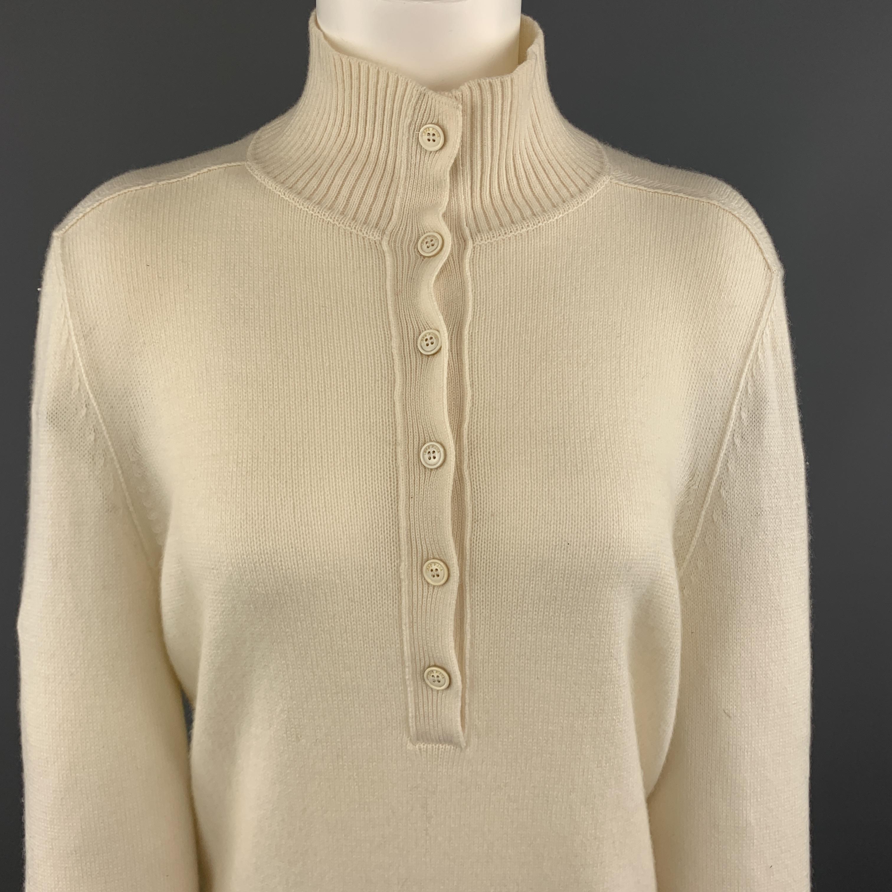 LORO PIANA pullover sweater comes in cream cashmere with a high mock neck, half button front, and ribbed details. Small hole in front. As-is. With Tags. Made in Italy.

Good Pre-Owned Condition.
Marked: IT 46

Measurements:

Shoulder: 16 in.
Bust: