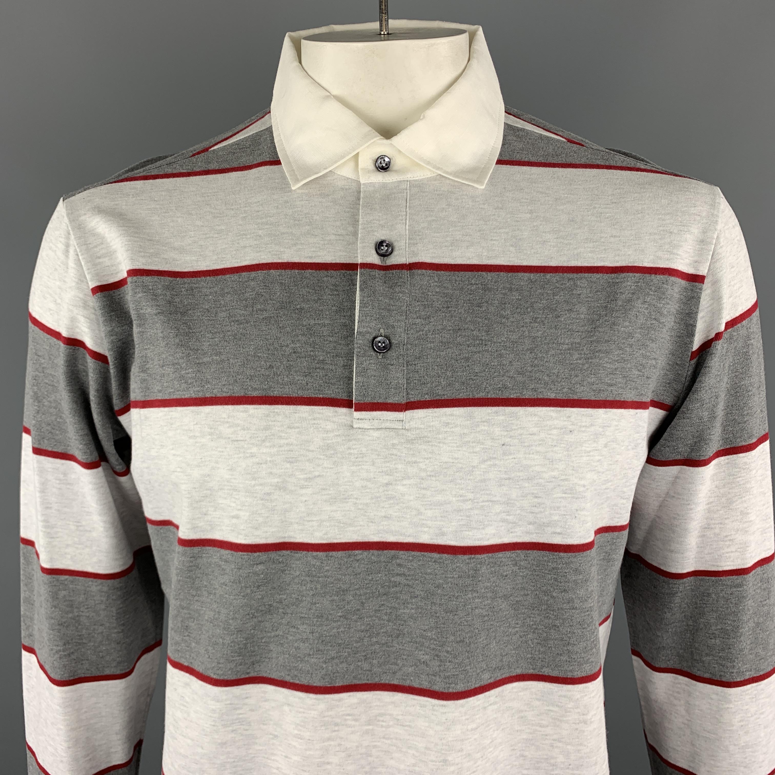 LORO PIANA Long Sleeve POLO comes in grey tones in a striped cotton material, half buttoned, with ribbed cuffs. Made in Italy.


New with Tags.
Marked: XL

Measurements:

Shoulder: 18 in.
Chest: 44 in.
Sleeve: 25.5 in.
Length: 27.5 in. 