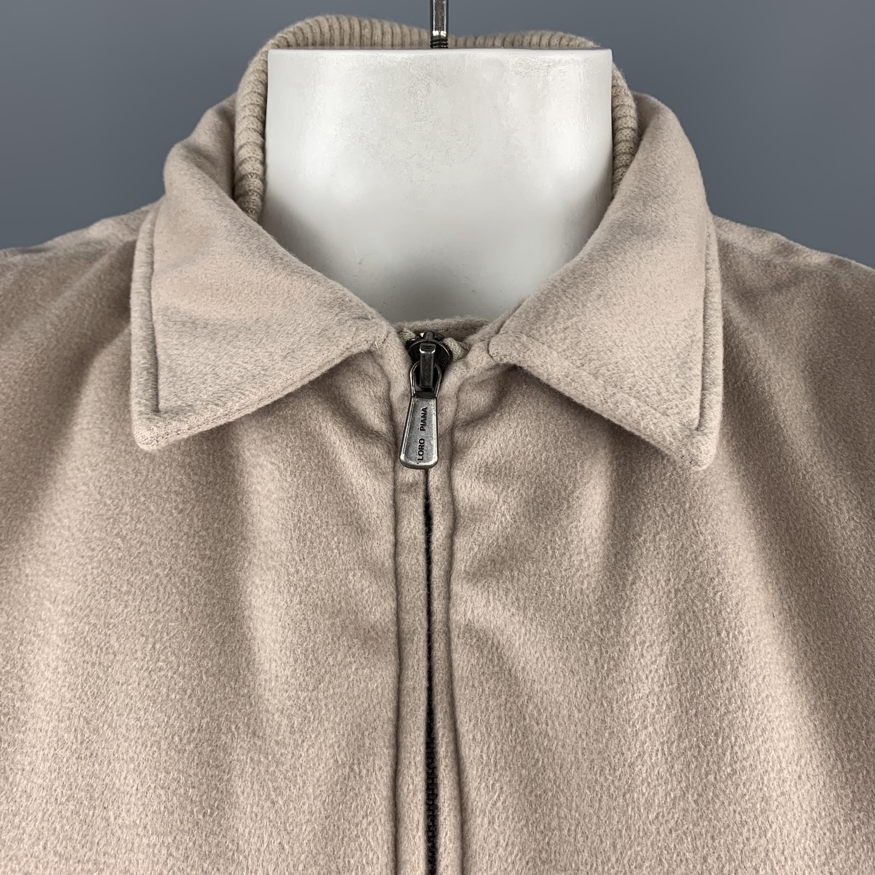 LORO PIANA Storm System vest comes in oatmeal beige cashmere with a high brown suede trimmed collar, double zip front, zip pockets, and ribbed cashmere knit inner collar. Made In Italy. 

Excellent Pre-Owned Condition. Retail price