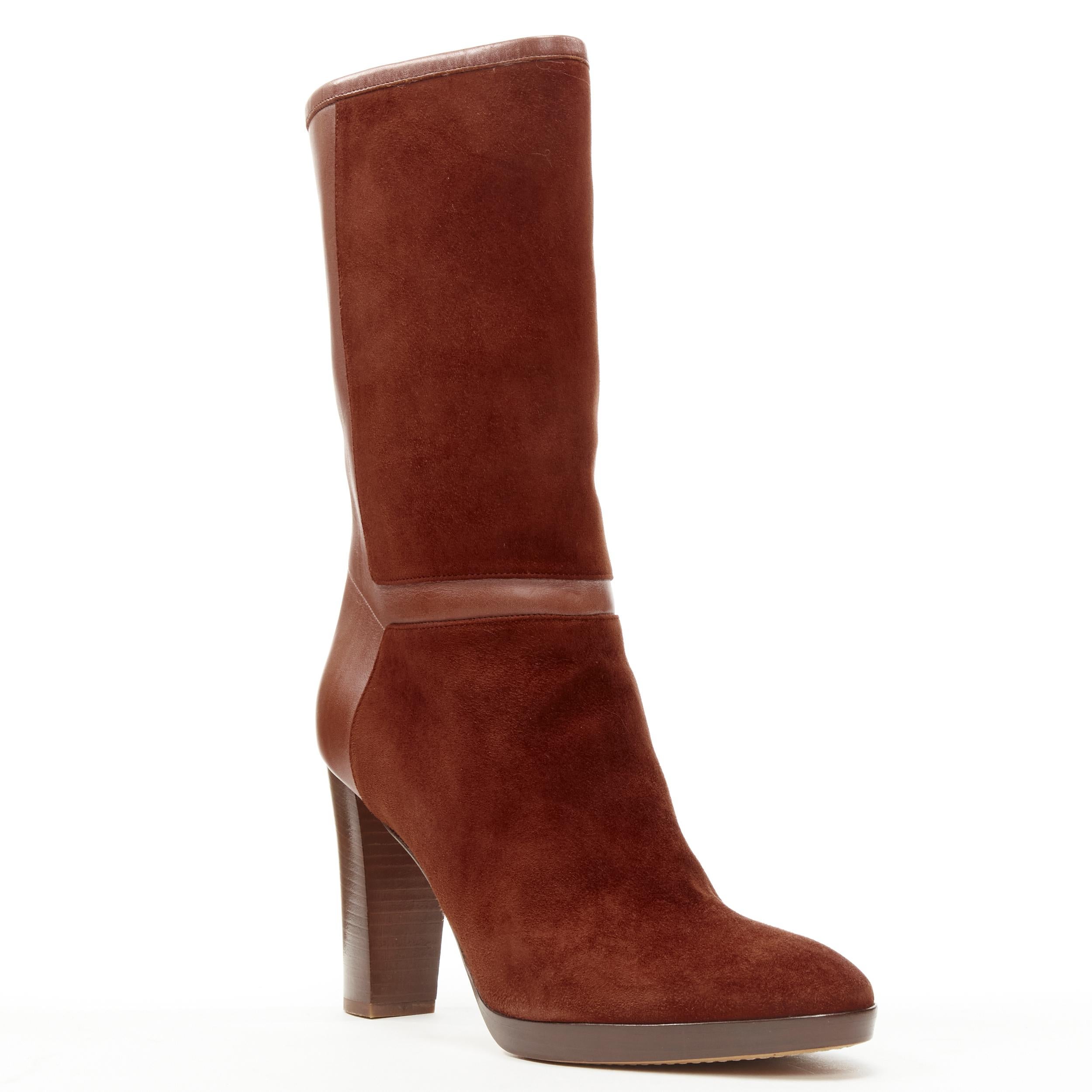 LORO PIANA Tempete Moyen Suede brown high heel pull on boots EU38 US8 
Reference: JNWG/A00017 
Brand: Loro Piana 
Material: Suede 
Color: Brown 
Pattern: Solid 
Extra Detail: Brick brown suede and leather upper. Gold-tone LP charm at back. Stacked