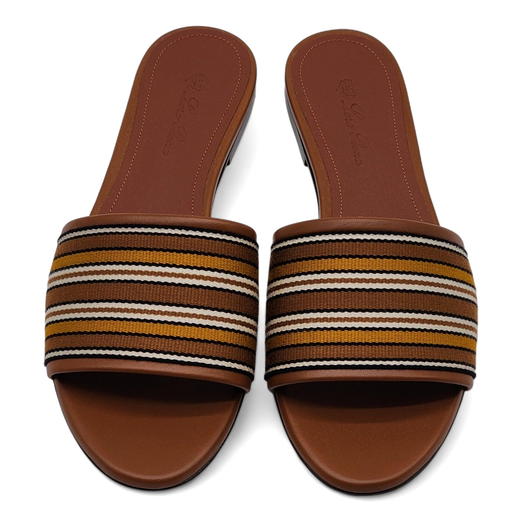 Loro Piana striped fabric travel sandals with leather trim.

Additional information:
Material: Fabric
Open toe, Wide band upper, Slide style, Leather outsole
Lining: Leather
Color: Brown
Size: 36 EU
Country: Italy
Dimension: 0.25 in / 10 mm flat