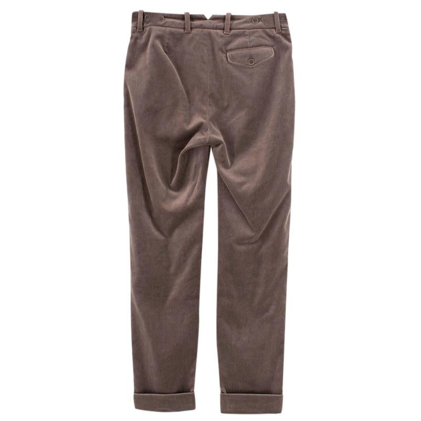 Loro Piana Velvet Straight Leg Pants

Velvet brown pants with turned hems
Brown hardware
Zip front closure
Centre button closure
Side strap and button detailing 
Dart stitch detailing 
One back pocket with button closure
Two slip pockets on front of