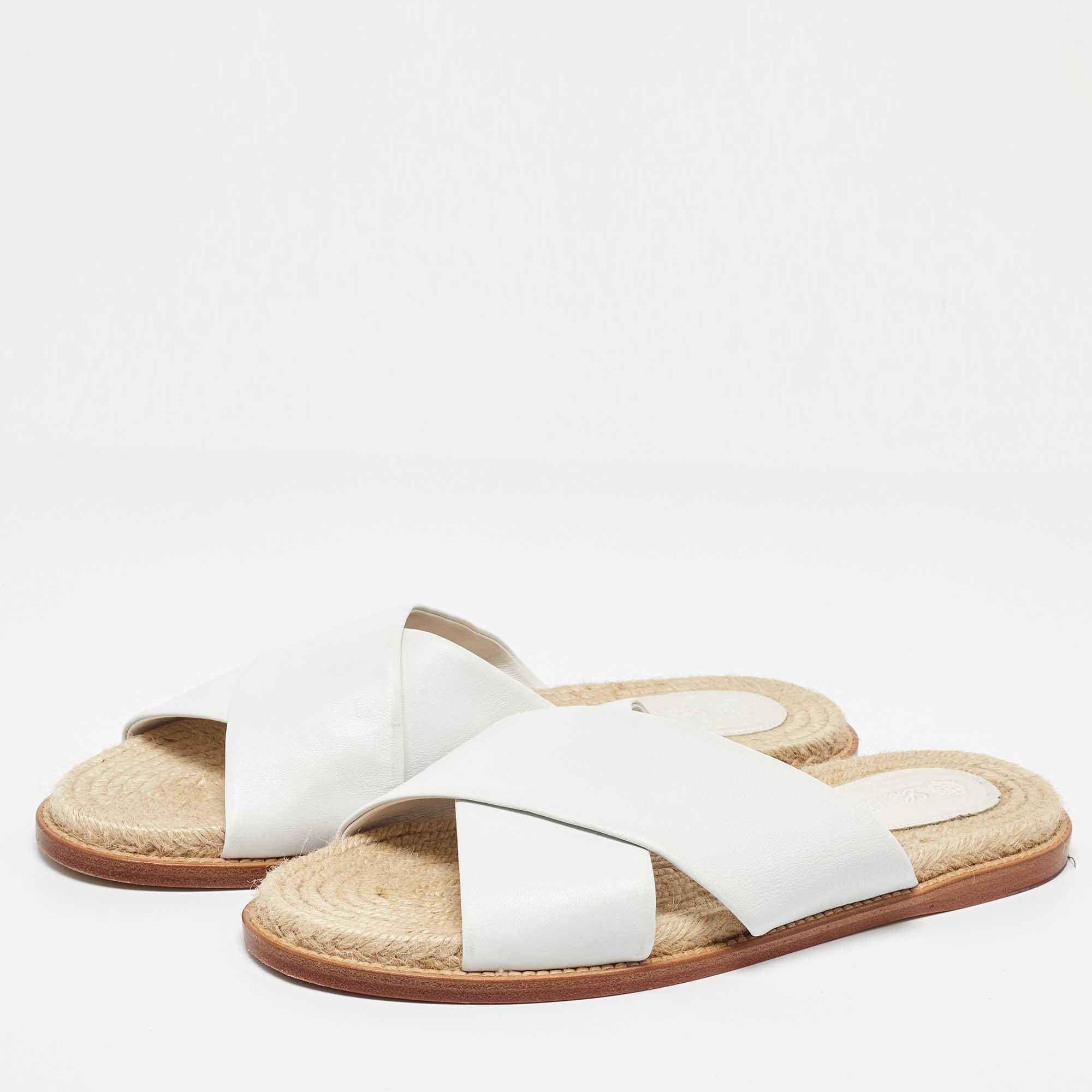 You would never want to take off these comfortable Loro Piana flats. They have white leather cross strap uppers and jute fabric insoles for the ultimate daytime elegance.